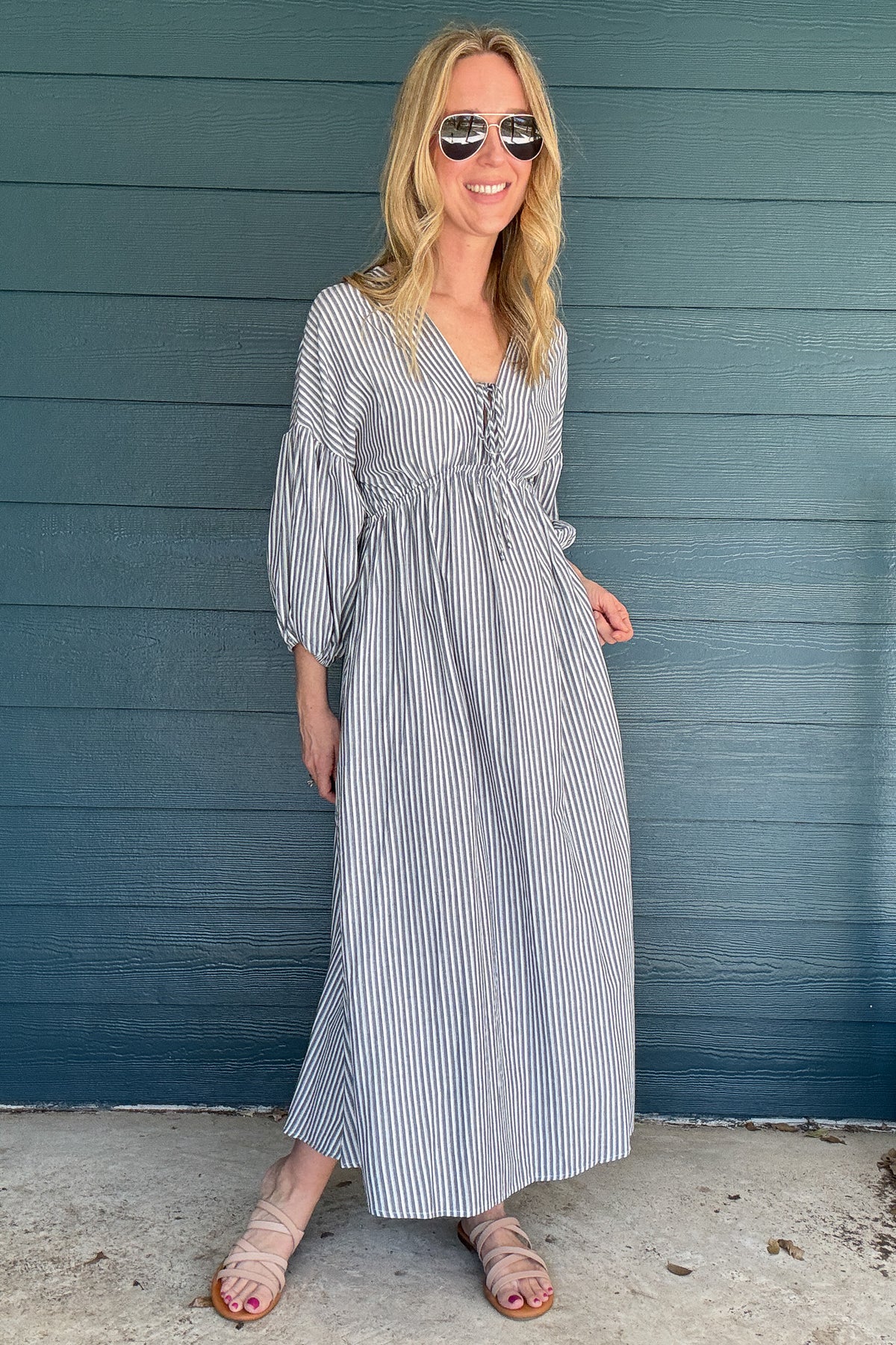Get beach-ready with our To the Beach Dress! This lightweight and unlined dress offers the perfect arm coverage and a flattering maxi fit. Throw it on for a day out in the sun or as a stylish cover-up. No matter how you wear it, this dress has got you covered (literally)!