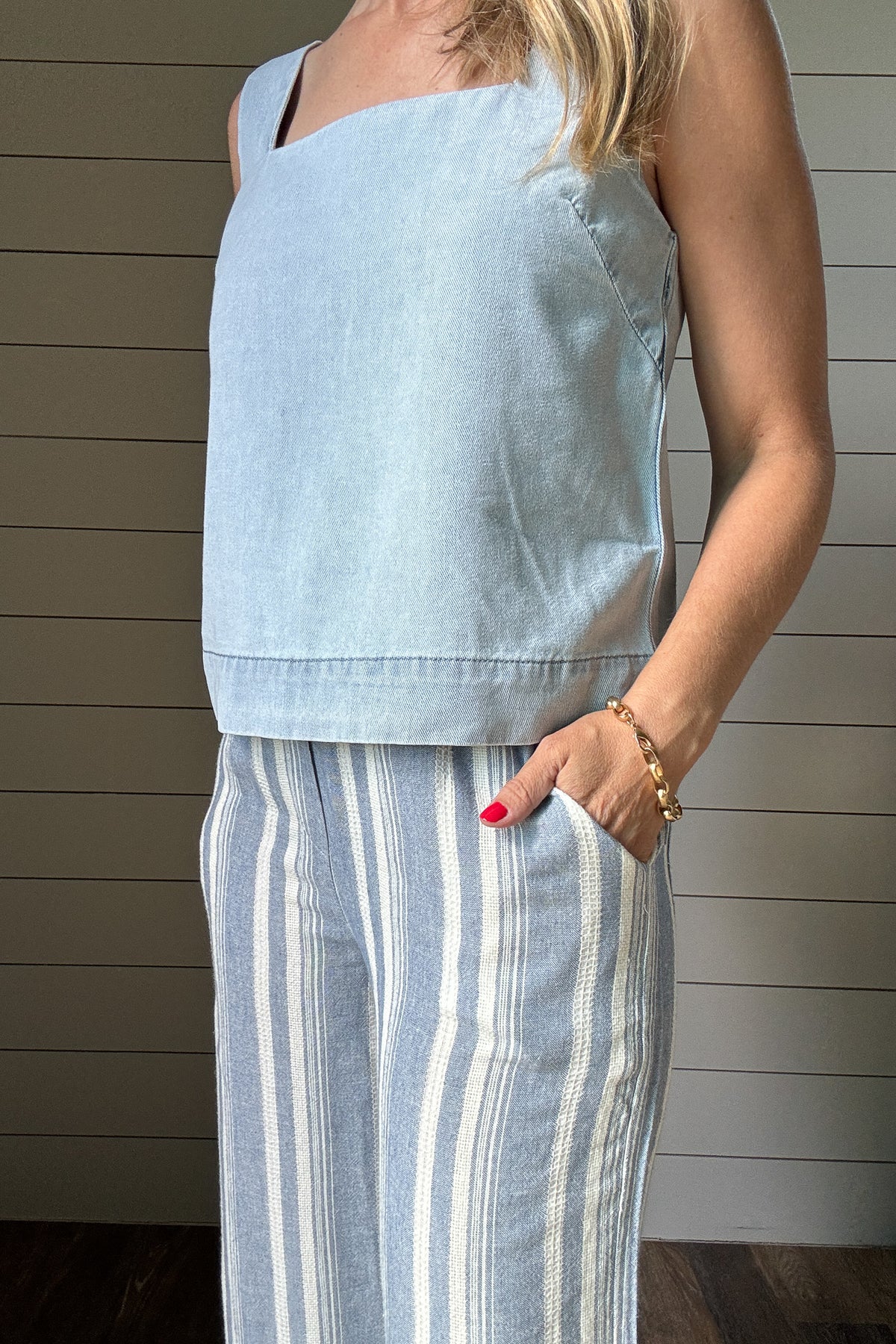 These striped wide leg pants are your go-to for an easy, breezy day. Made from a lightweight fabric, they’re unlined for cool comfort and feature functional front and back pockets. The relaxed fit and vertical stripes keep things flattering and laid back- perfect for travel, errands, or a casual lunch out.