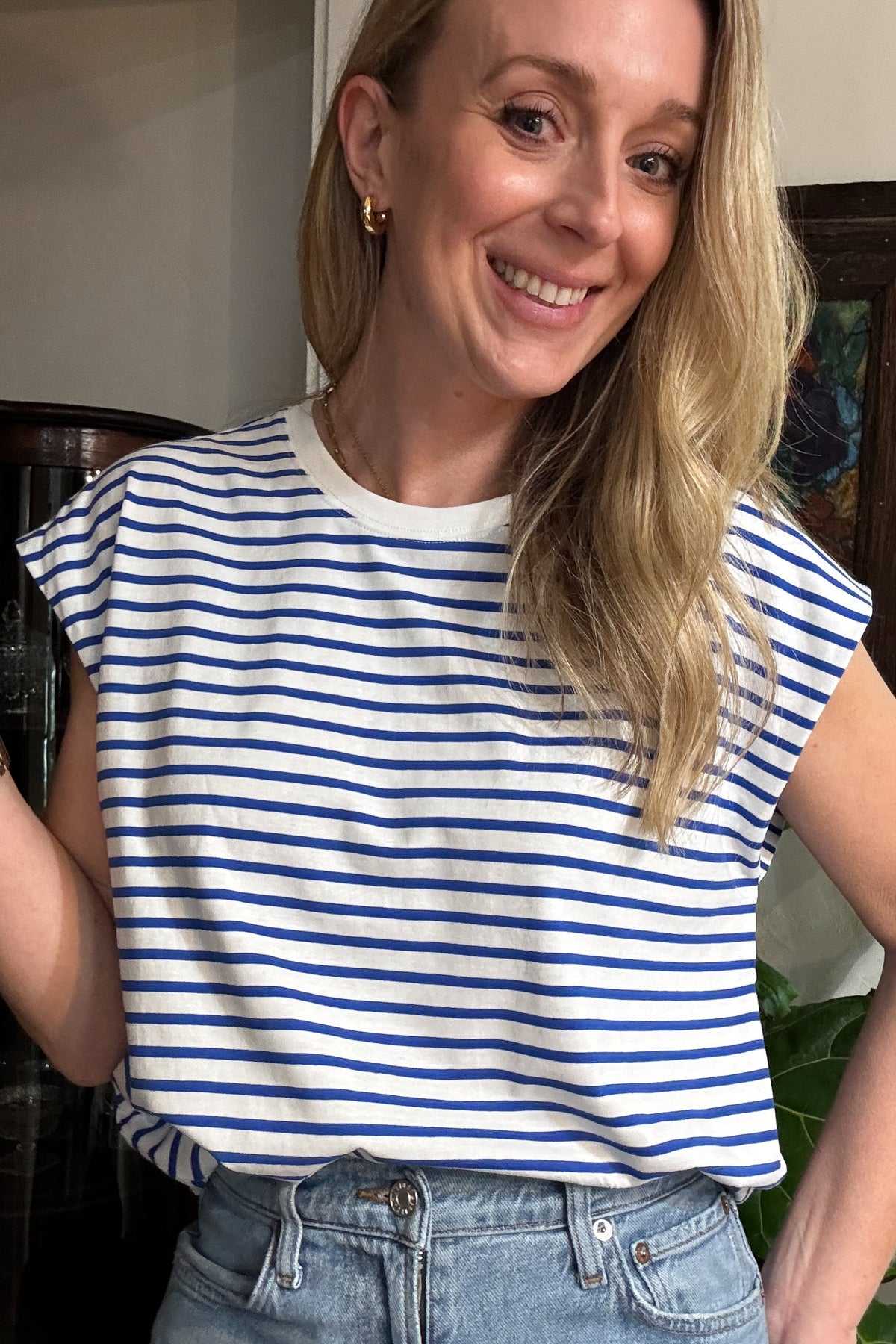 You're going to love this versatile top! Designed to be worn with a front tie or tucked in, this 100% cotton cap sleeve tee shirt is roomy, flattering and fun. The bright blue and white fabric is not see through and holds its shape beautifully. It is made to be worn on repeat. Brighten up your day with this top! Ships quickly from our warehouse in Texas. 