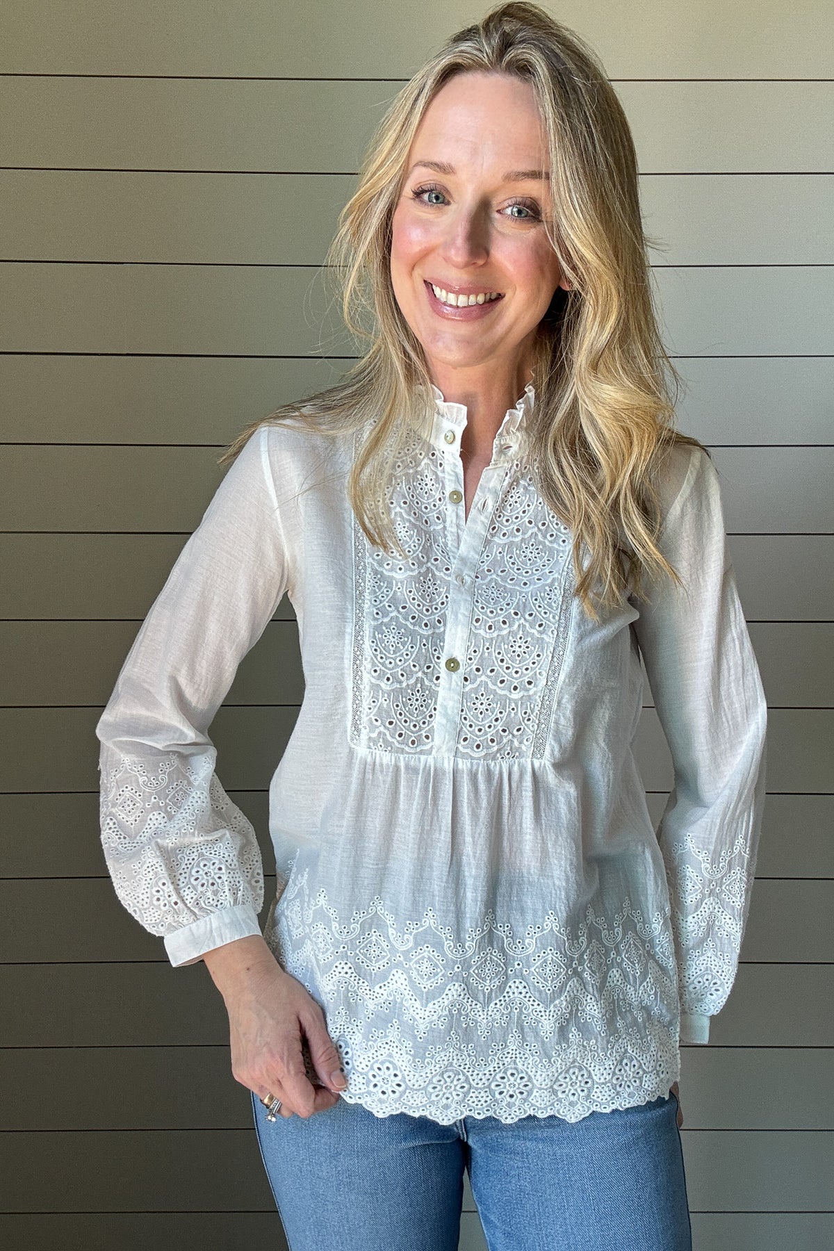 This 100% organic cotton blouse is the perfect blend of delicate charm and effortless style. Designed with intricate eyelet detailing, it adds a feminine touch to any look. The lightweight, breathable fabric makes it a go-to for warm days, while the soft cotton keeps you comfortable all day long.