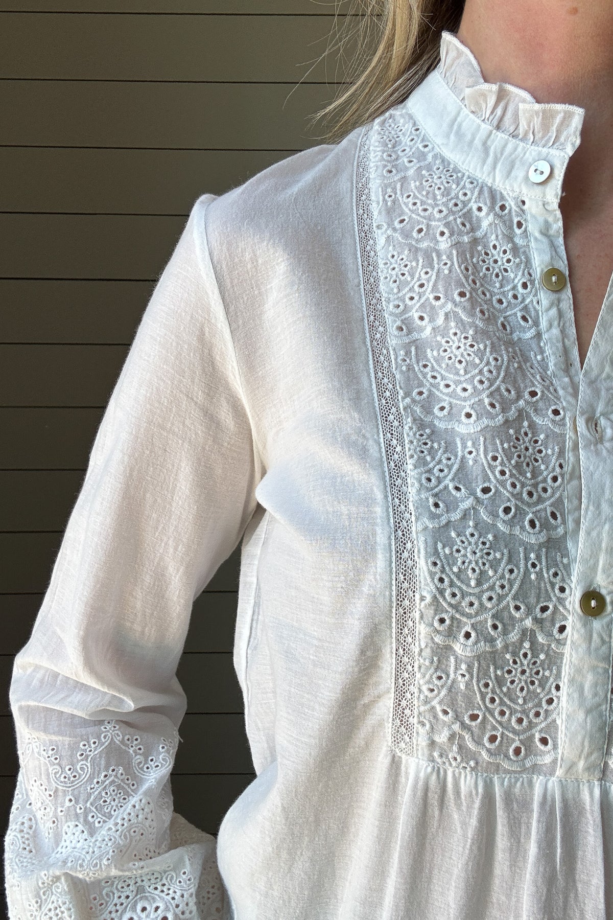 This 100% organic cotton blouse is the perfect blend of delicate charm and effortless style. Designed with intricate eyelet detailing, it adds a feminine touch to any look. The lightweight, breathable fabric makes it a go-to for warm days, while the soft cotton keeps you comfortable all day long.