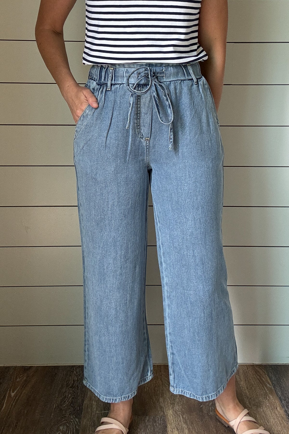These cropped pants look like denim but feel softer and lighter, thanks to a lyocell-cotton blend. The pull-on style with a drawstring waist makes them easy to wear every day. The wide leg and cropped length give them a relaxed, effortless look that works with sneakers, sandals, or slides.