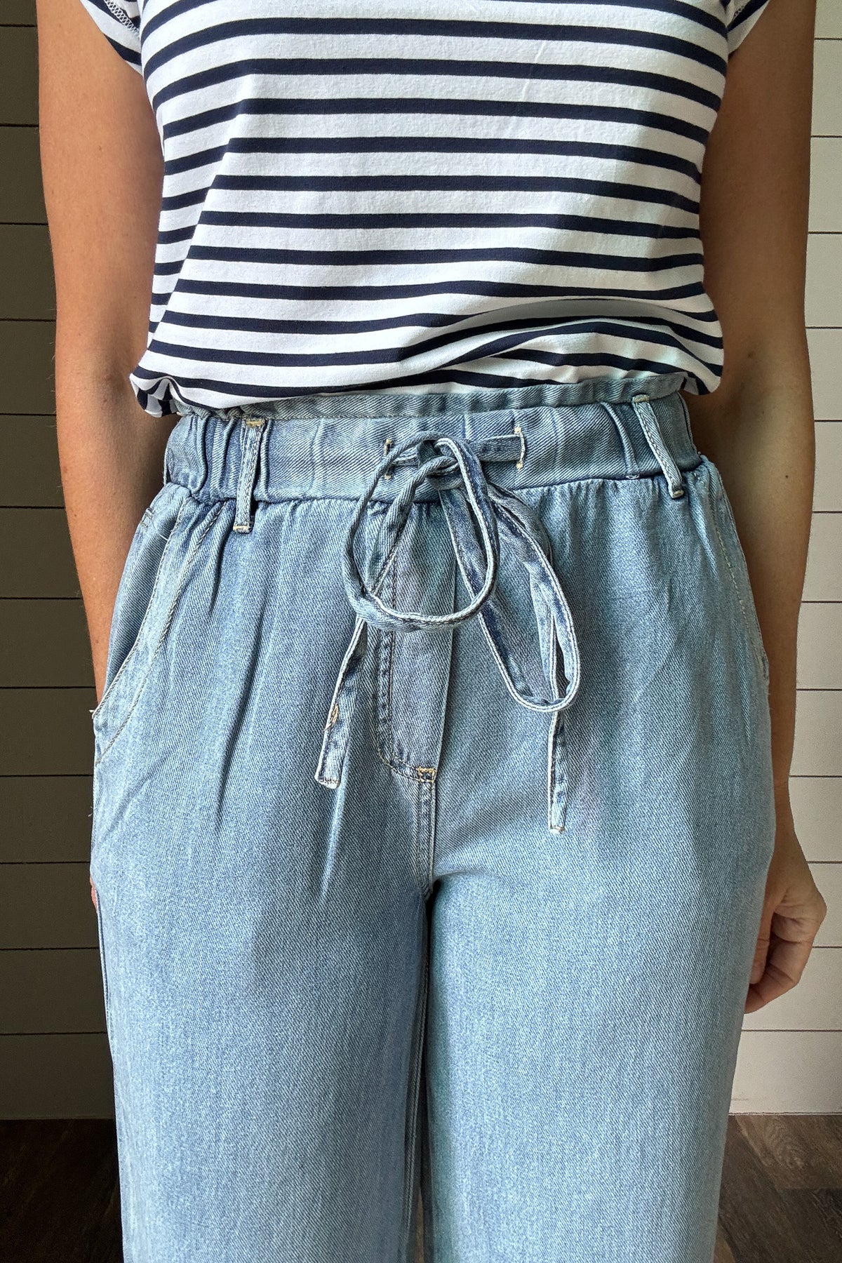 These cropped pants look like denim but feel softer and lighter, thanks to a lyocell-cotton blend. The pull-on style with a drawstring waist makes them easy to wear every day. The wide leg and cropped length give them a relaxed, effortless look that works with sneakers, sandals, or slides.