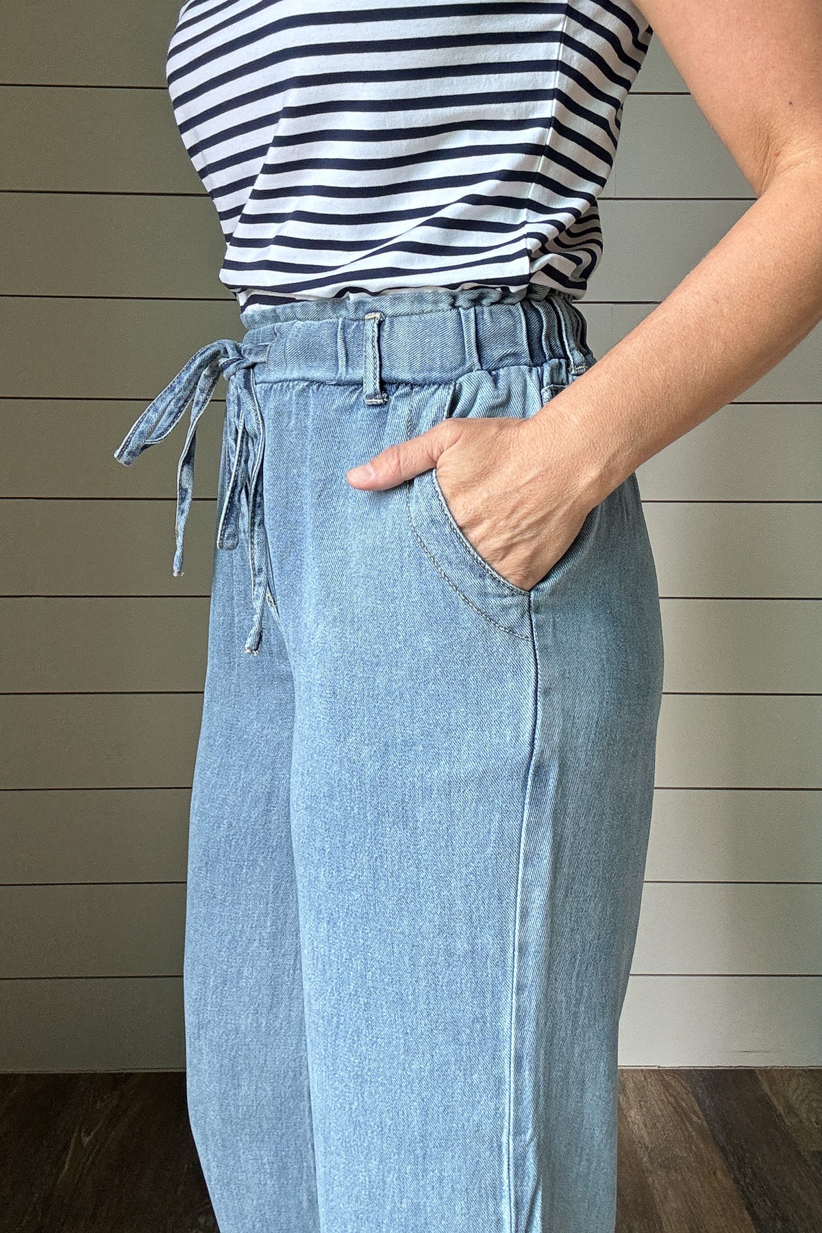 These cropped pants look like denim but feel softer and lighter, thanks to a lyocell-cotton blend. The pull-on style with a drawstring waist makes them easy to wear every day. The wide leg and cropped length give them a relaxed, effortless look that works with sneakers, sandals, or slides.