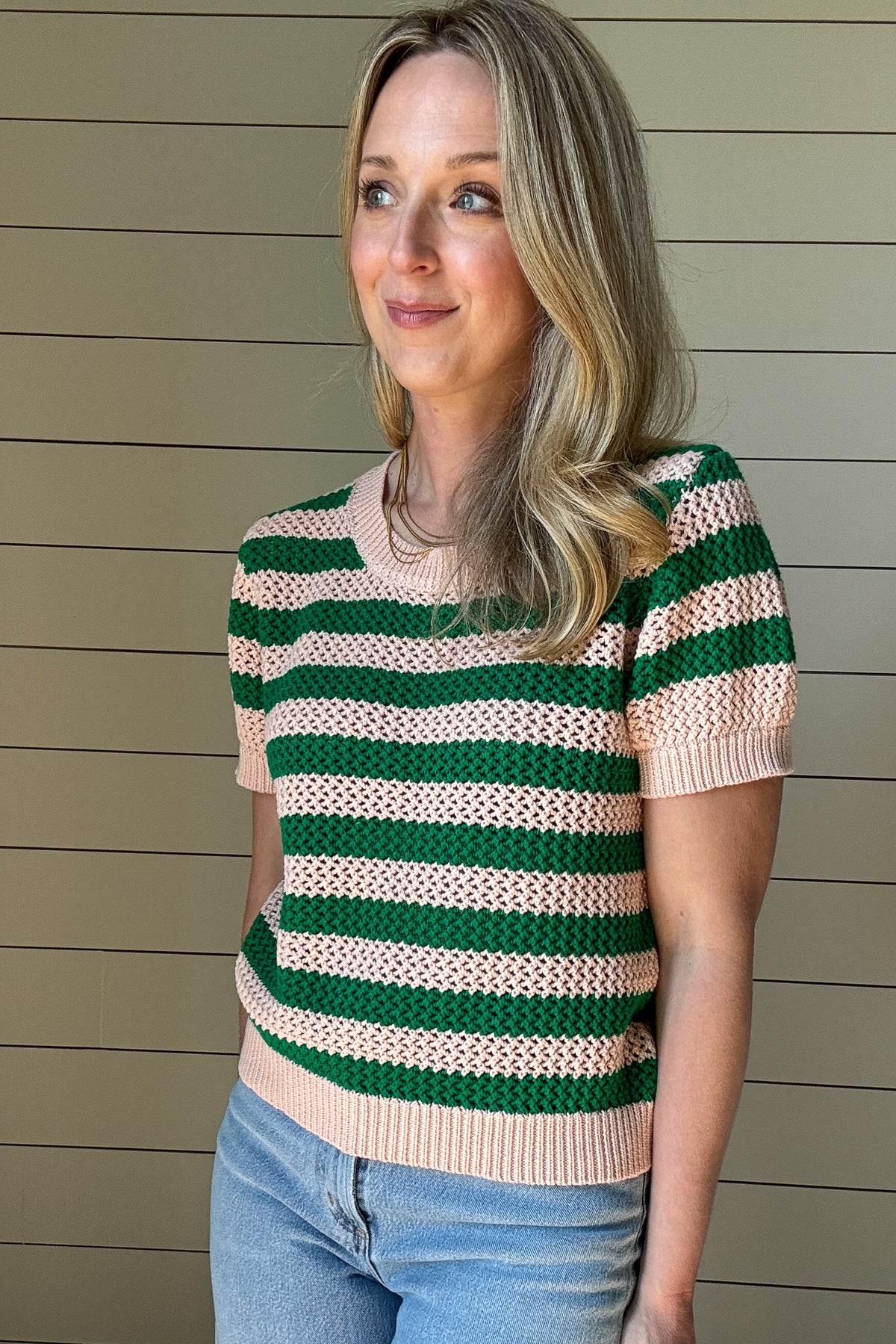 The close knit Green & Blush Short Sleeve Top is the perfect blend of timeless style and everyday comfort. Crafted from 100% cotton, this breathable knit top offers a lightweight feel while maintaining a cozy texture. The intricate open-knit pattern showcases alternating green and blush stripes, creating a fresh and vibrant look.
With its classic crew neckline and ribbed trim on the sleeves and hem, this top provides a flattering and effortless fit. The short sleeves make it an easy transitional piece,