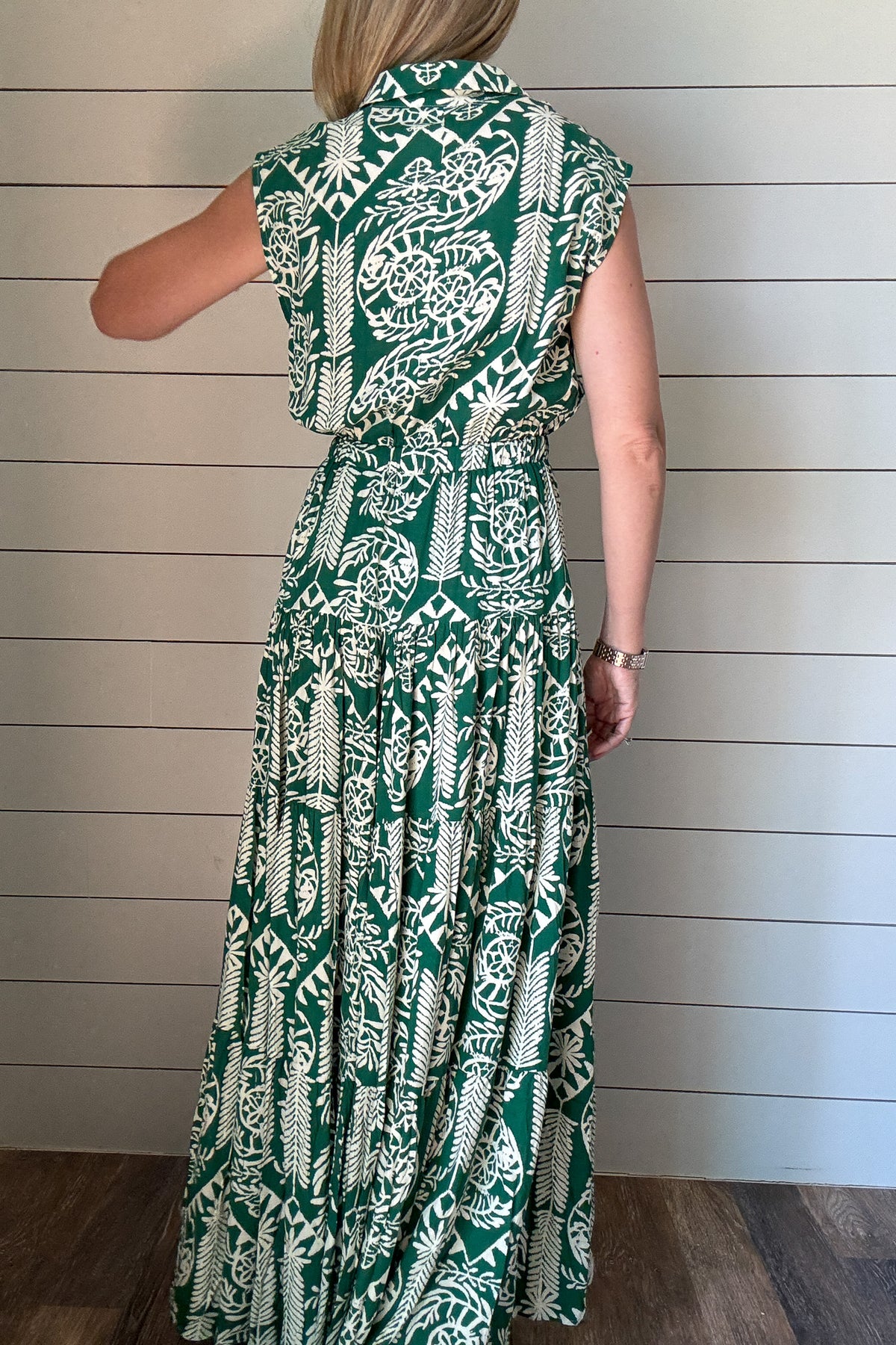  Meet your new favorite warm-weather dress. This green and cream print maxi is made from buttery soft fabric that drapes beautifully and feels like a dream. The tiered silhouette gives it an easy, flowy shape, and the drawstring waist lets you adjust for the perfect fit. A collared neckline and slightly capped sleeves keep the look polished, but still relaxed enough for everyday wear.