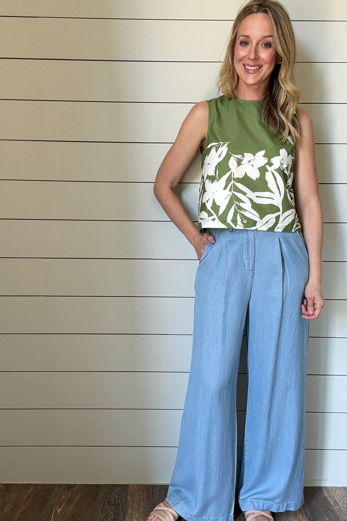 Breezy and effortlessly chic, this sleeveless floral-print top is a perfect blend of structure and ease. With an outer shell that is crafted from100% cotton, it features a fully lined lightweight interior for a polished finish and comfortable wear. The vibrant green base is accented with a bold white floral pattern, bringing a fresh, botanical touch to your wardrobe.