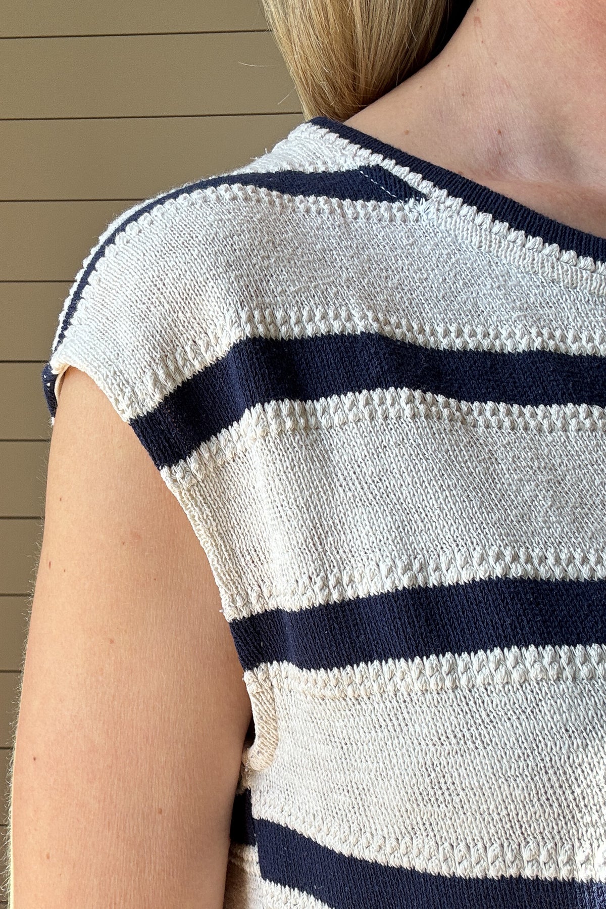 Effortlessly elevate your summer wardrobe with our Sleeveless Navy & Cream Texture Knit Striped Top.
Made with a navy and cream textured knit, this top offers a casual yet stylish look.
With its loose fit and sleeveless design, it's the perfect choice for a comfortable and effortlessly chic outfit.