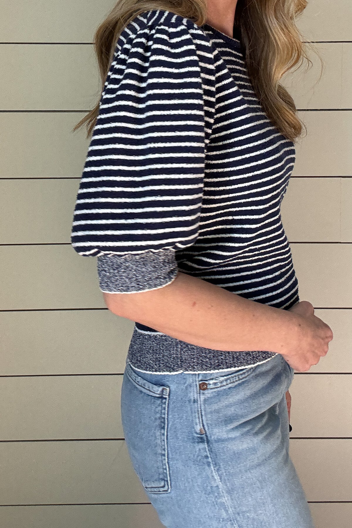 Get ready to rock this Navy Striped Short Sleeve Knit Top! Made with recycled materials, this French-designed sweater features a fitted bodice and a classic style with a playful twist - a striped bodice with heathered edging.
Perfect for adding a touch of charm to your wardrobe. 
