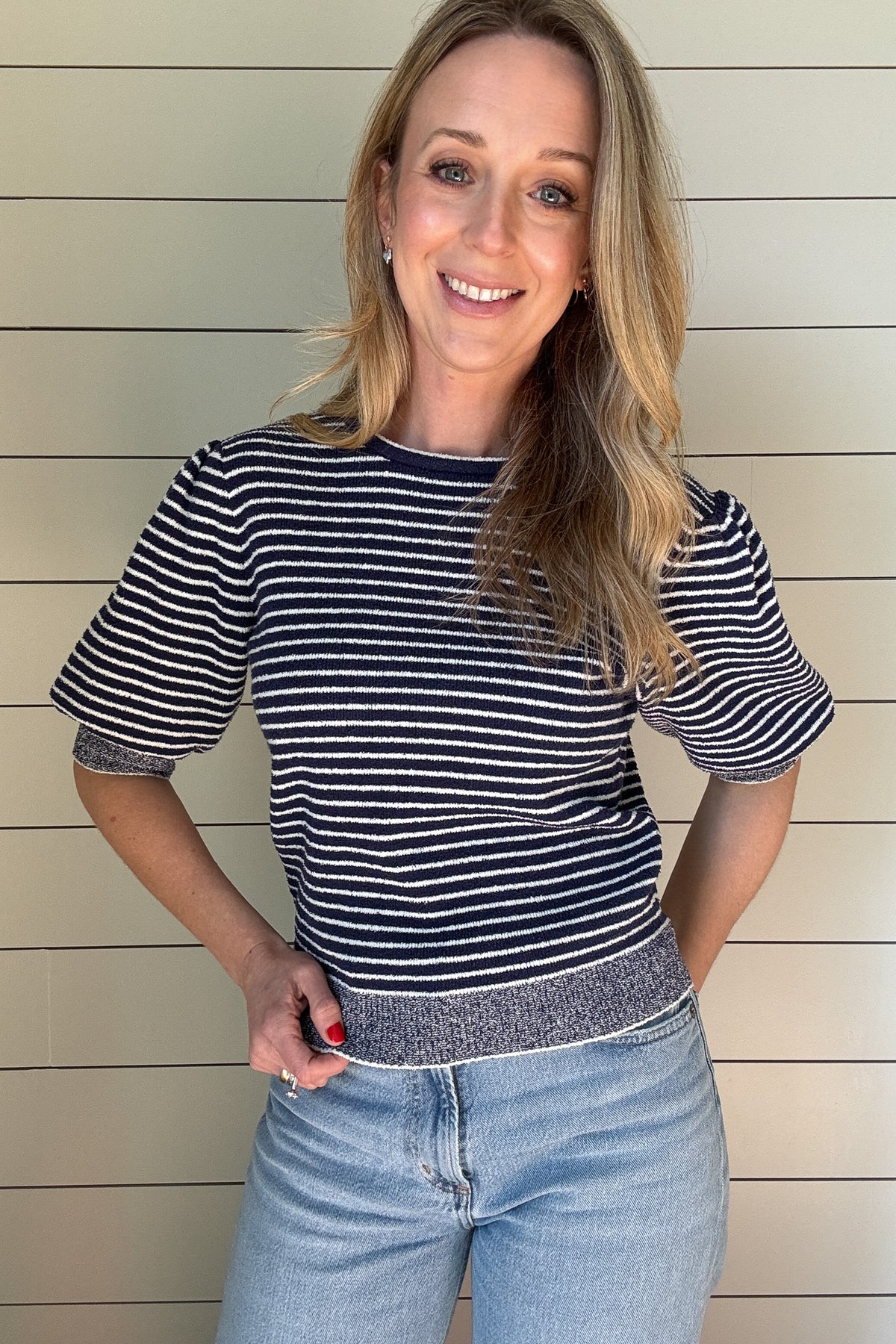 Get ready to rock this Navy Striped Short Sleeve Knit Top! Made with recycled materials, this French-designed sweater features a fitted bodice and a classic style with a playful twist - a striped bodice with heathered edging.
Perfect for adding a touch of charm to your wardrobe. 