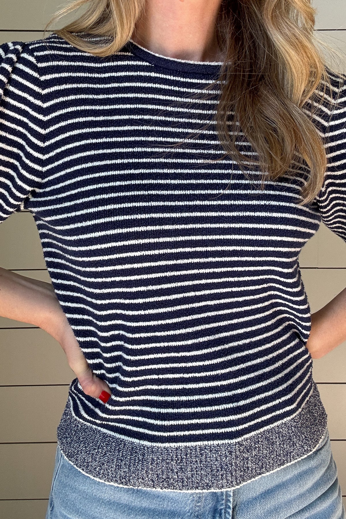Get ready to rock this Navy Striped Short Sleeve Knit Top! Made with recycled materials, this French-designed sweater features a fitted bodice and a classic style with a playful twist - a striped bodice with heathered edging.
Perfect for adding a touch of charm to your wardrobe. 