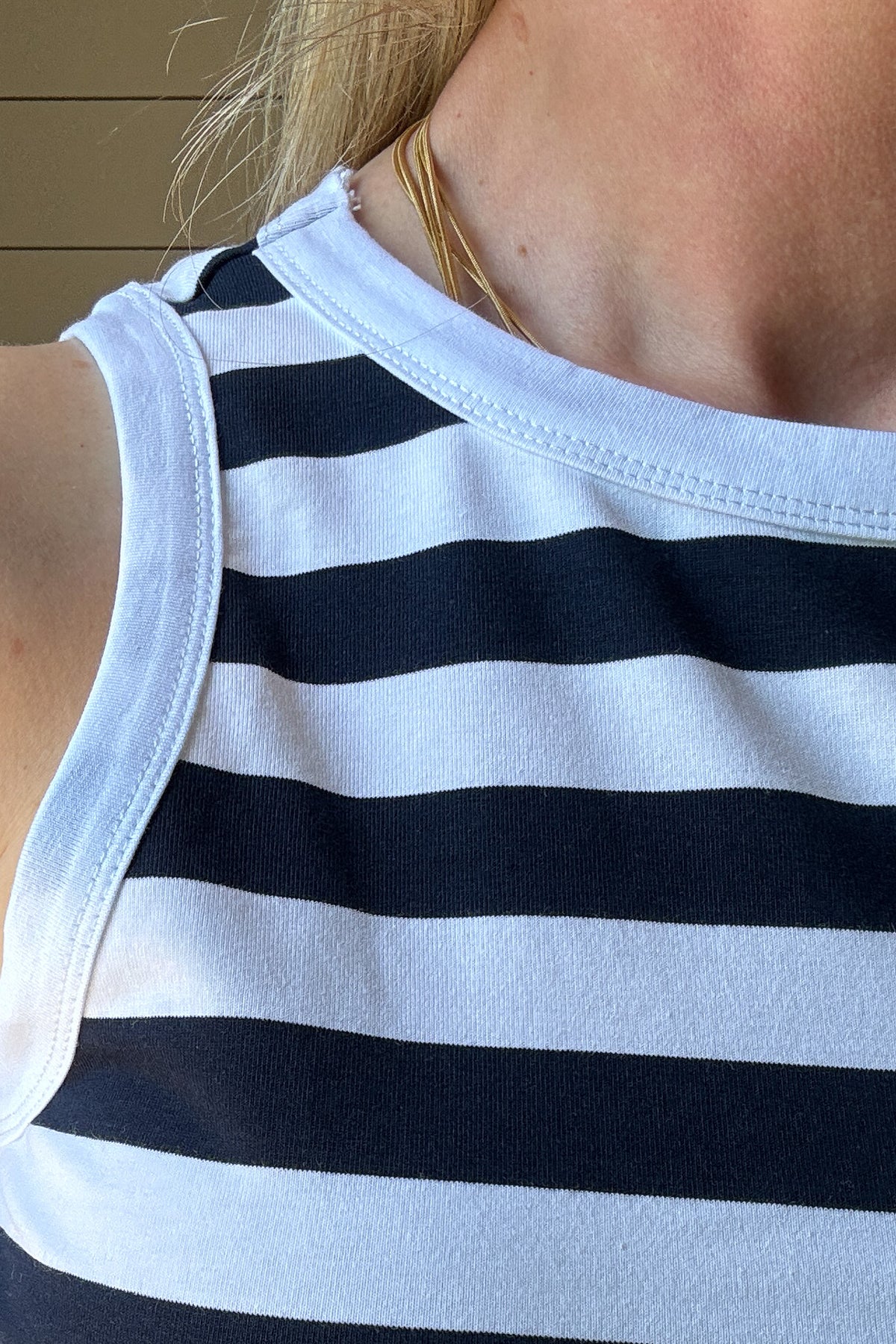 The classic Navy & White Striped Tank is a must-have staple for effortless, everyday style. Made from a soft and breathable blend of 98% cotton and 2% spandex, this tank offers the perfect amount of stretch while maintaining its structured shape. The classic navy and white stripes bring a timeless, nautical-inspired vibe, making it an easy go-to for warm days and layering.