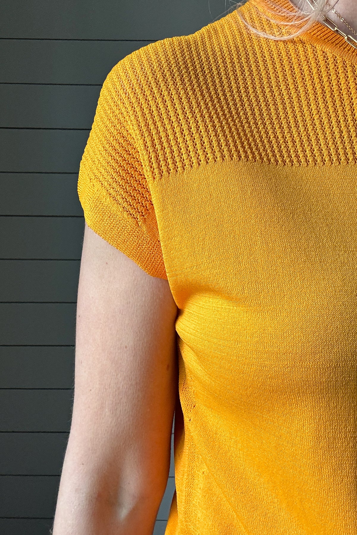 Elevate your spring style with our Orange Crush Knit Top by Current Air. The open weave design over the shoulders and upper chest adds a touch of lightness to this vibrant and fun top. Lightweight, stretchy and layer-able, this top will brighten up your outfit & day!