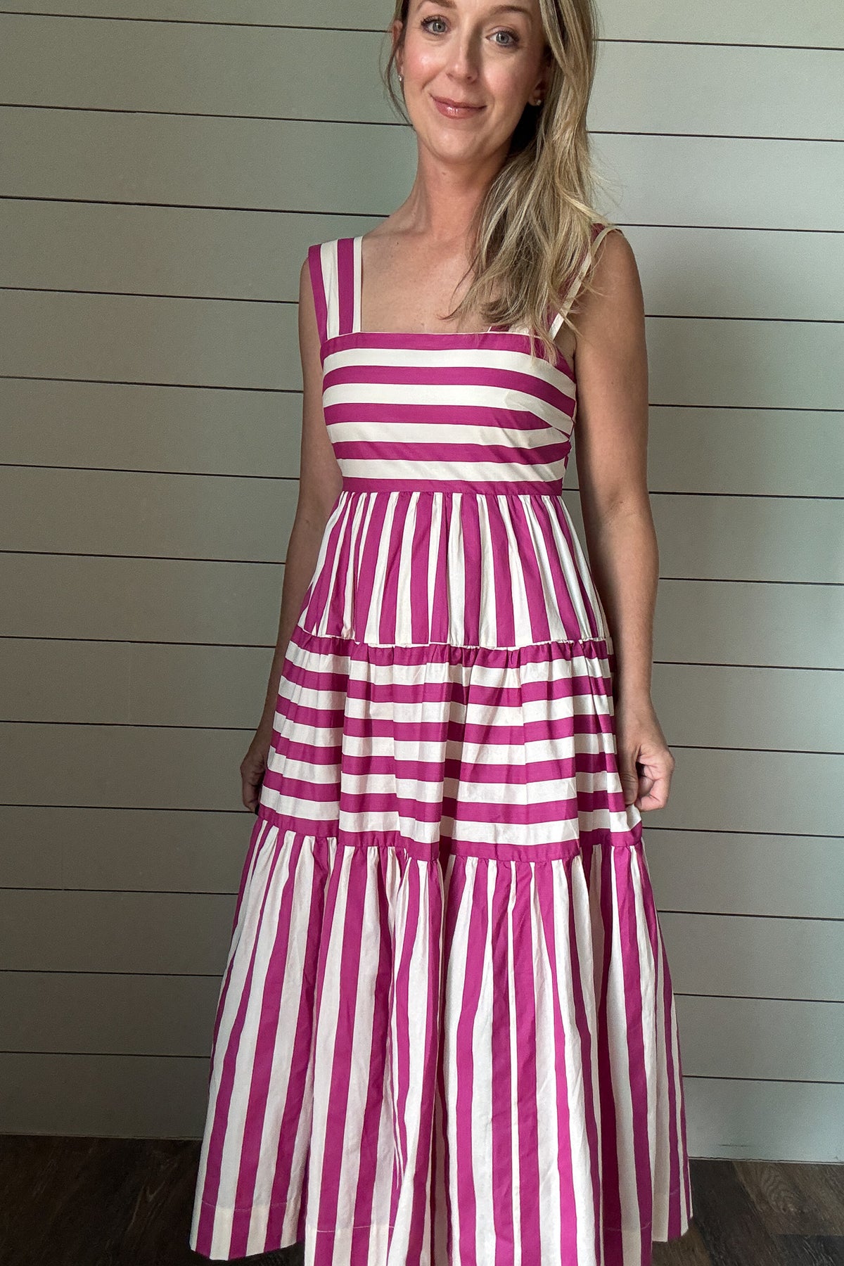  This dress brings all the joy. With bold pink and white stripes and a playful tiered skirt, it’s made for sunshine and smiles. The wide straps and square neckline give it a flattering, modern shape while the lined cotton fabric keeps it breezy and comfortable. No pockets means a smooth, easy fit—just add sandals and go.