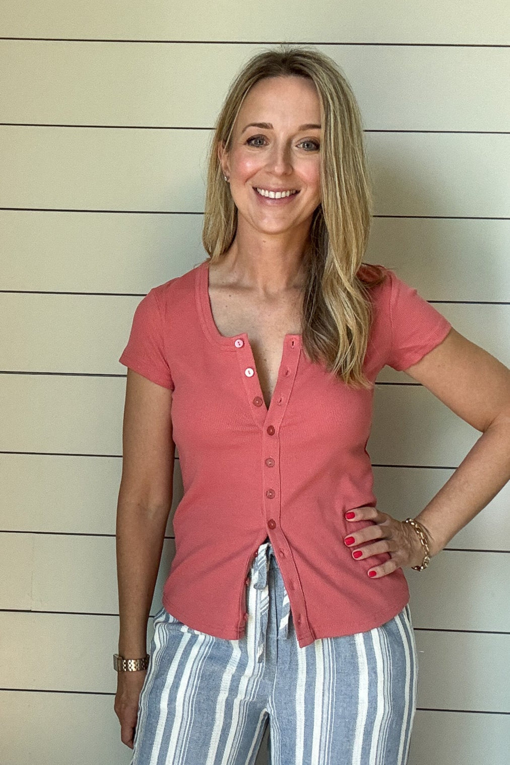  Soft, stretchy, and made to flatter—this ribbed knit tee from Thread & Supply is a fresh take on an everyday favorite. It features a scoop neckline and full button-down front so you can wear it closed or unbuttoned. The fabric is ribbed, giving great coverage. Light and comfy for summer days, and perfect for layering into fall.