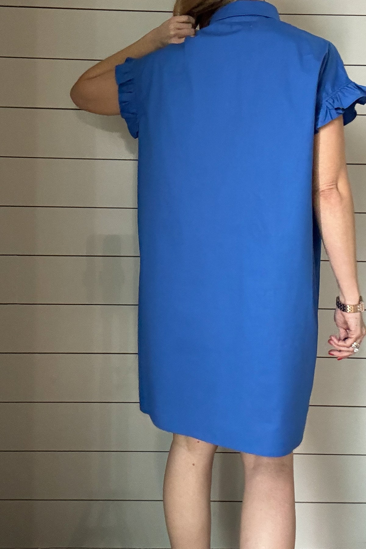This is the dress that'll take you through Spring & Summer. 100% poplin cotton, feminine shoulder detailing & baby ruffles on the sleeves in the most flattering shade of blue. No pockets or lining on this dress, it is made to keep things lightweight.
