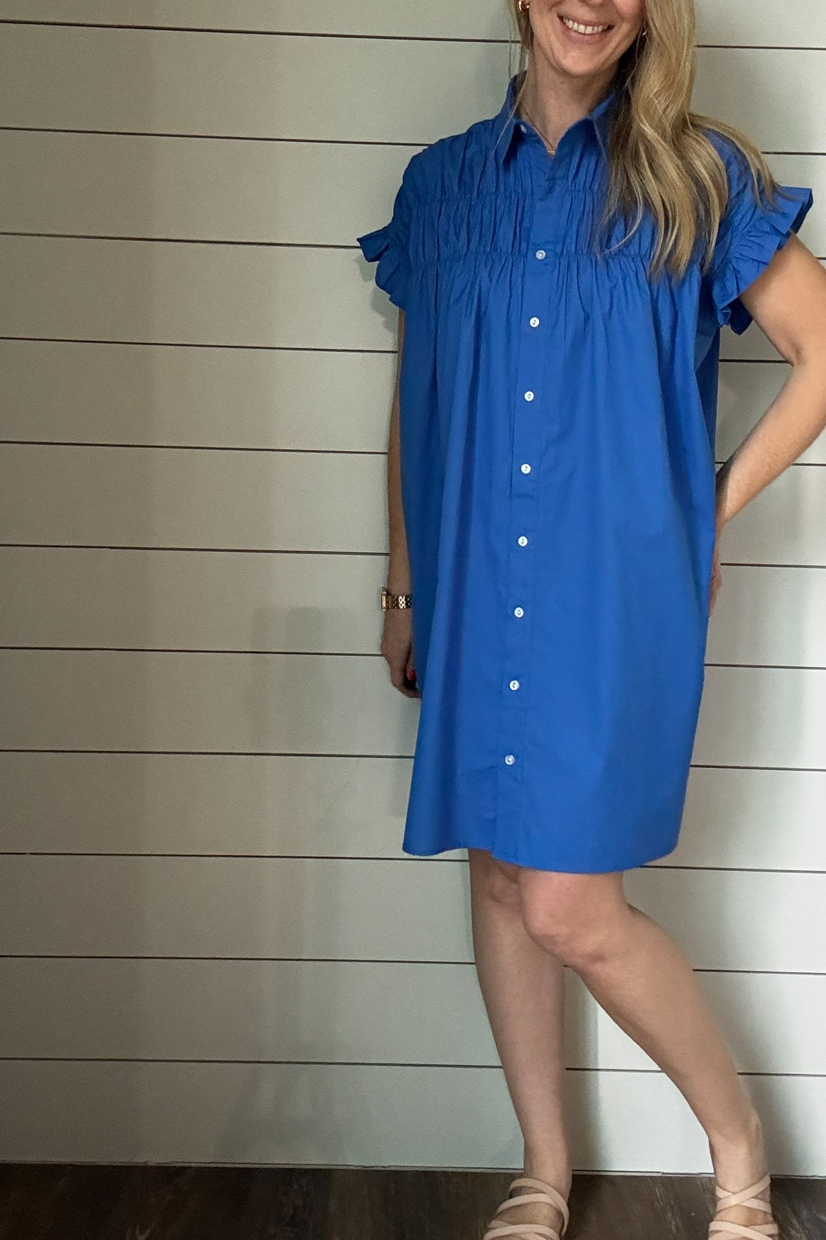 This is the dress that'll take you through Spring & Summer. 100% poplin cotton, feminine shoulder detailing & baby ruffles on the sleeves in the most flattering shade of blue. No pockets or lining on this dress, it is made to keep things lightweight.