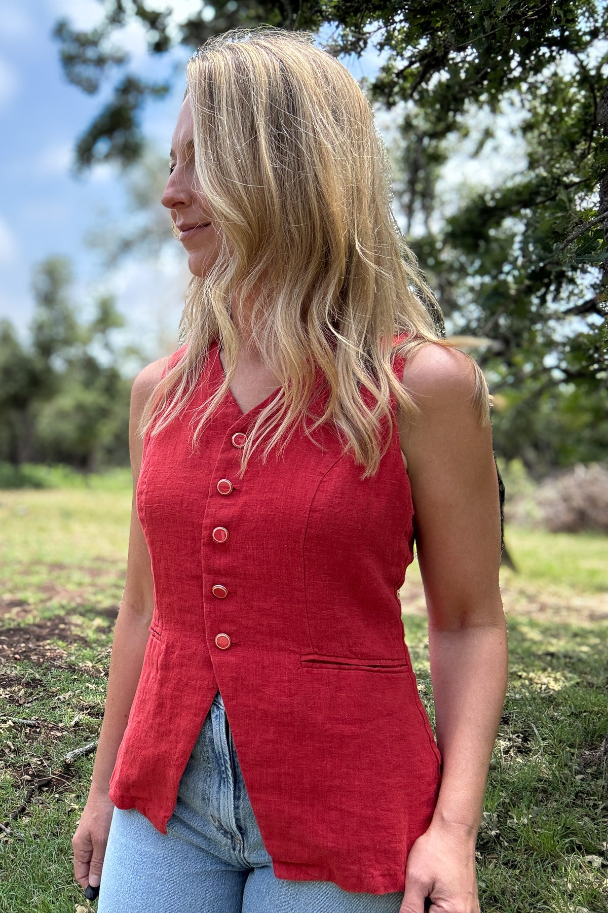 A bold yet easy layering piece, this chili red vest brings structure and effortless style to any look. Lightweight and breathable, it works well on its own or layered over a tee. The tailored cut flatters without feeling too stiff, and the rich color adds a fun pop to your wardrobe.