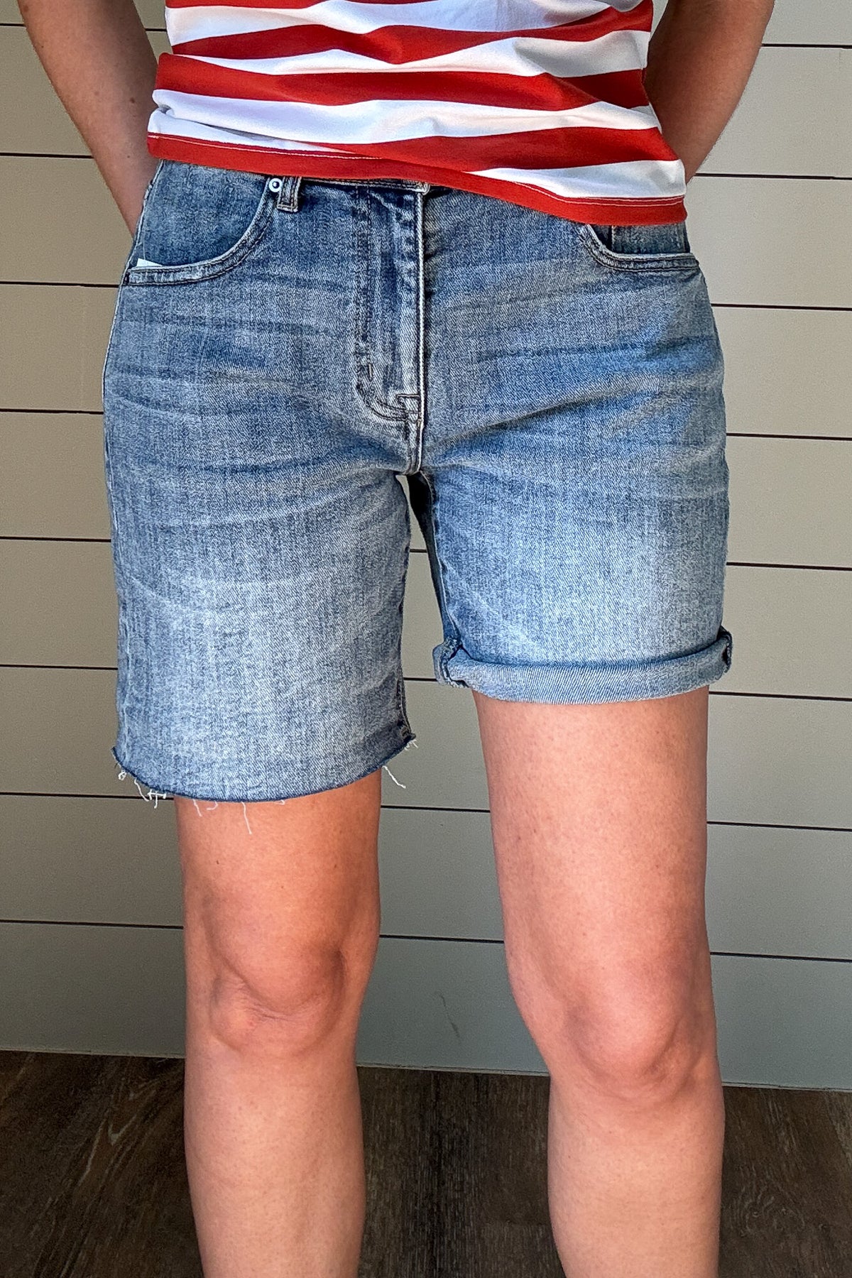 Meet your new favorite denim short! With a 6.5” raw hem that can be rolled for a customized length, these shorts offer effortless versatility. Designed with a straight cut that fits comfortably in the thigh—no clinging here—while gently tapering at the waist for a flattering fit. Perfect for the mom who wants a modern, stylish short without the “mom short” feel. Dress them up or down for an easy, go-to summer look!