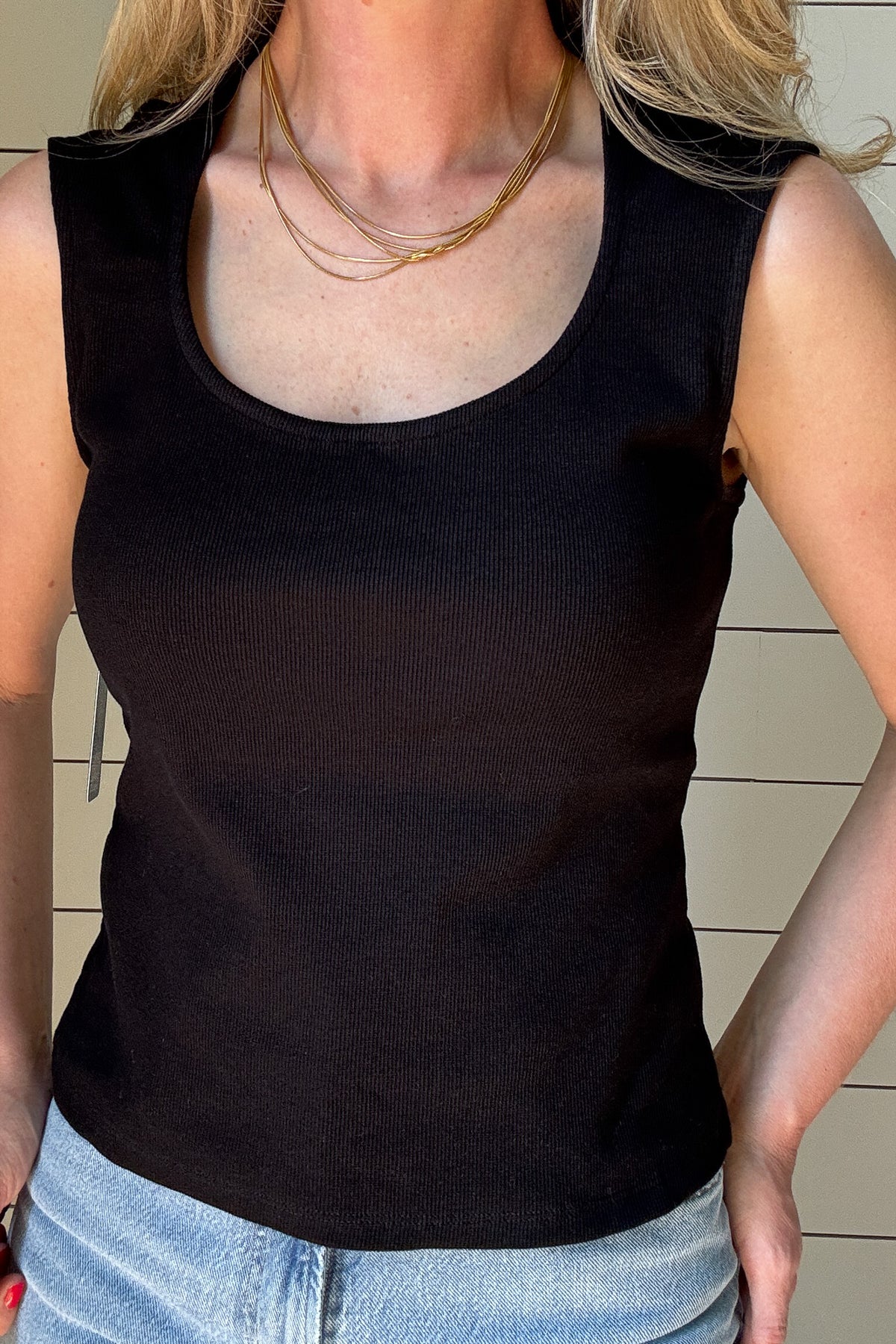 This black ribbed tank is a must-have staple for any wardrobe. Designed with a flattering sweetheart neckline and wide shoulder coverage, it offers a chic yet effortless look that’s perfect for layering or wearing on its own. The fitted silhouette hugs your curves in all the right places, while the ribbed texture adds a touch of sophistication.