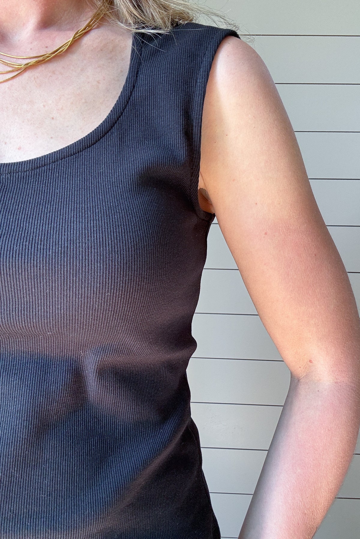This black ribbed tank is a must-have staple for any wardrobe. Designed with a flattering sweetheart neckline and wide shoulder coverage, it offers a chic yet effortless look that’s perfect for layering or wearing on its own. The fitted silhouette hugs your curves in all the right places, while the ribbed texture adds a touch of sophistication.