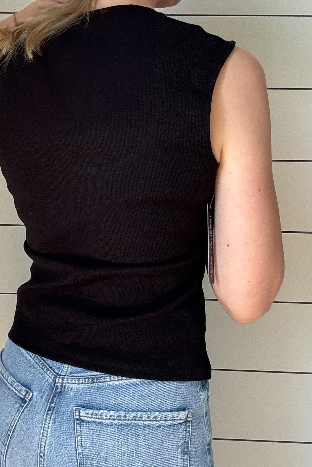 This black ribbed tank is a must-have staple for any wardrobe. Designed with a flattering sweetheart neckline and wide shoulder coverage, it offers a chic yet effortless look that’s perfect for layering or wearing on its own. The fitted silhouette hugs your curves in all the right places, while the ribbed texture adds a touch of sophistication.