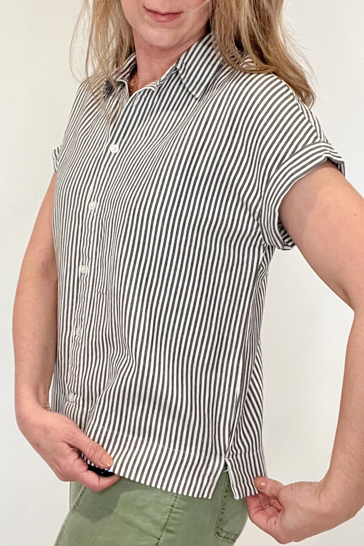 The Revel top is effortlessly beautiful with&nbsp; stripes, a split hem &amp;&nbsp;a tacked rolled sleeve.&nbsp;Made from 100% cotton, this stylish striped shirt is versatile enough to pair with any casual denim and sandals. Let it be your go-to piece for effortless fashion.