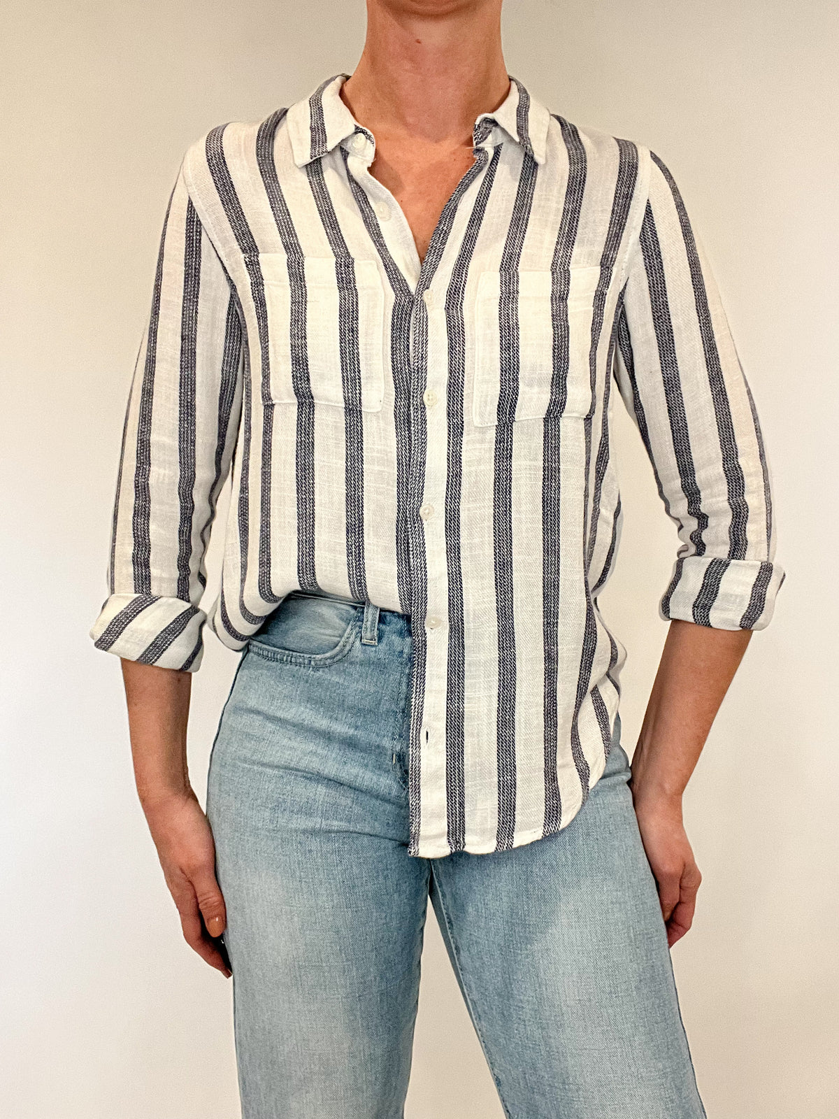 Introducing the Bestie Shirt in Blue, your new companion for the spring and summer season. Made with a luxurious linen blend, this stylish striped shirt is versatile enough to pair with any casual denim and sandals. Let it be your go-to piece for effortless fashion.