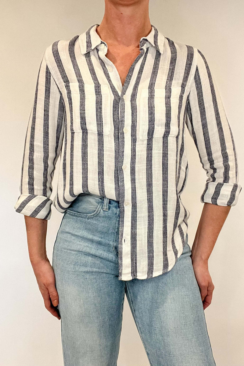 Introducing the Bestie Shirt in Blue, your new companion for the spring and summer season. Made with a luxurious linen blend, this stylish striped shirt is versatile enough to pair with any casual denim and sandals. Let it be your go-to piece for effortless fashion.