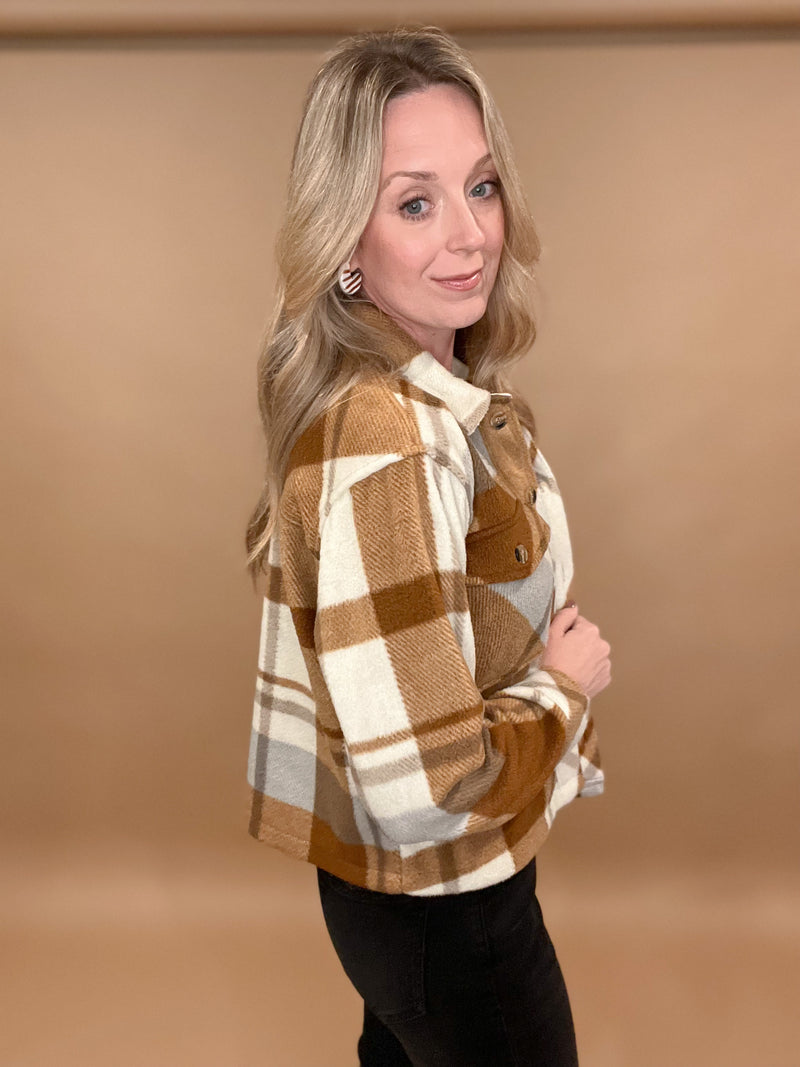 Be ready to make a statement in style with this luxurious Perfect Plaid Jacket. Crafted of soft fleece in a warm copper and brown plaid tone and featuring a snap front with collar, this cropped jacket provides a fashionable, yet practical, look. Make a sophisticated impression that will stand out from the crowd.