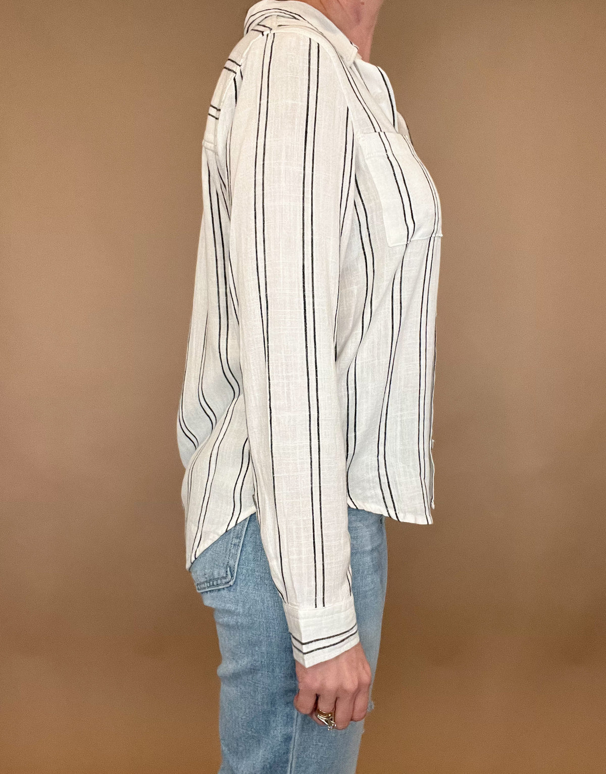 Introducing the Bestie Shirt in Black, your new companion for the spring and summer season. Made with a luxurious linen blend, this stylish striped shirt is versatile enough to pair with any casual denim and sandals. Let it be your go-to piece for effortless fashion.