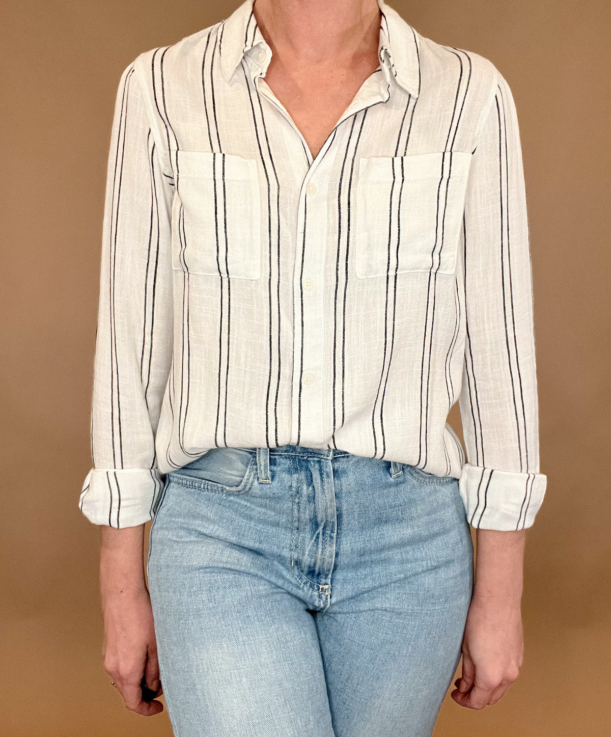 Introducing the Bestie Shirt in Black, your new companion for the spring and summer season. Made with a luxurious linen blend, this stylish striped shirt is versatile enough to pair with any casual denim and sandals. Let it be your go-to piece for effortless fashion.