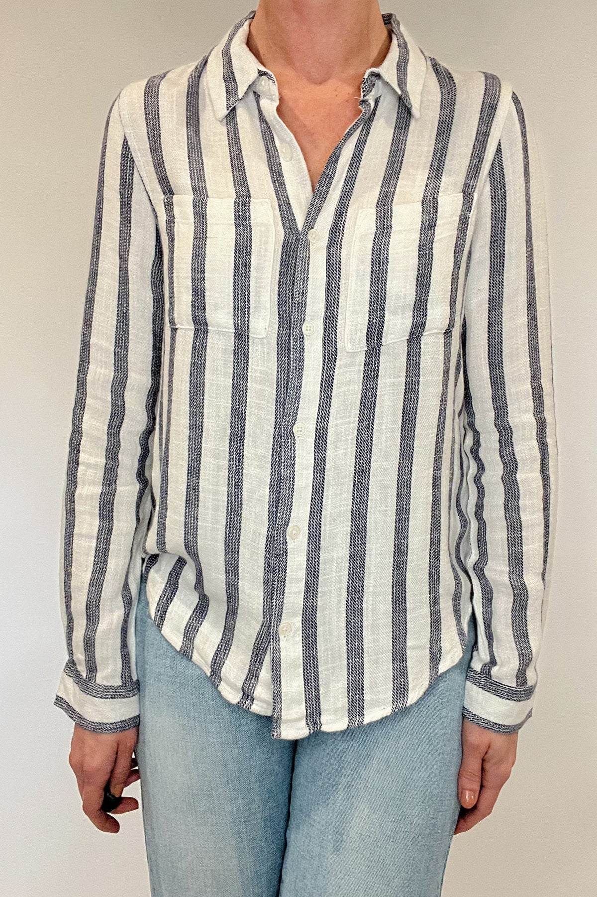 Introducing the Bestie Shirt in Blue, your new companion for the spring and summer season. Made with a luxurious linen blend, this stylish striped shirt is versatile enough to pair with any casual denim and sandals. Let it be your go-to piece for effortless fashion.