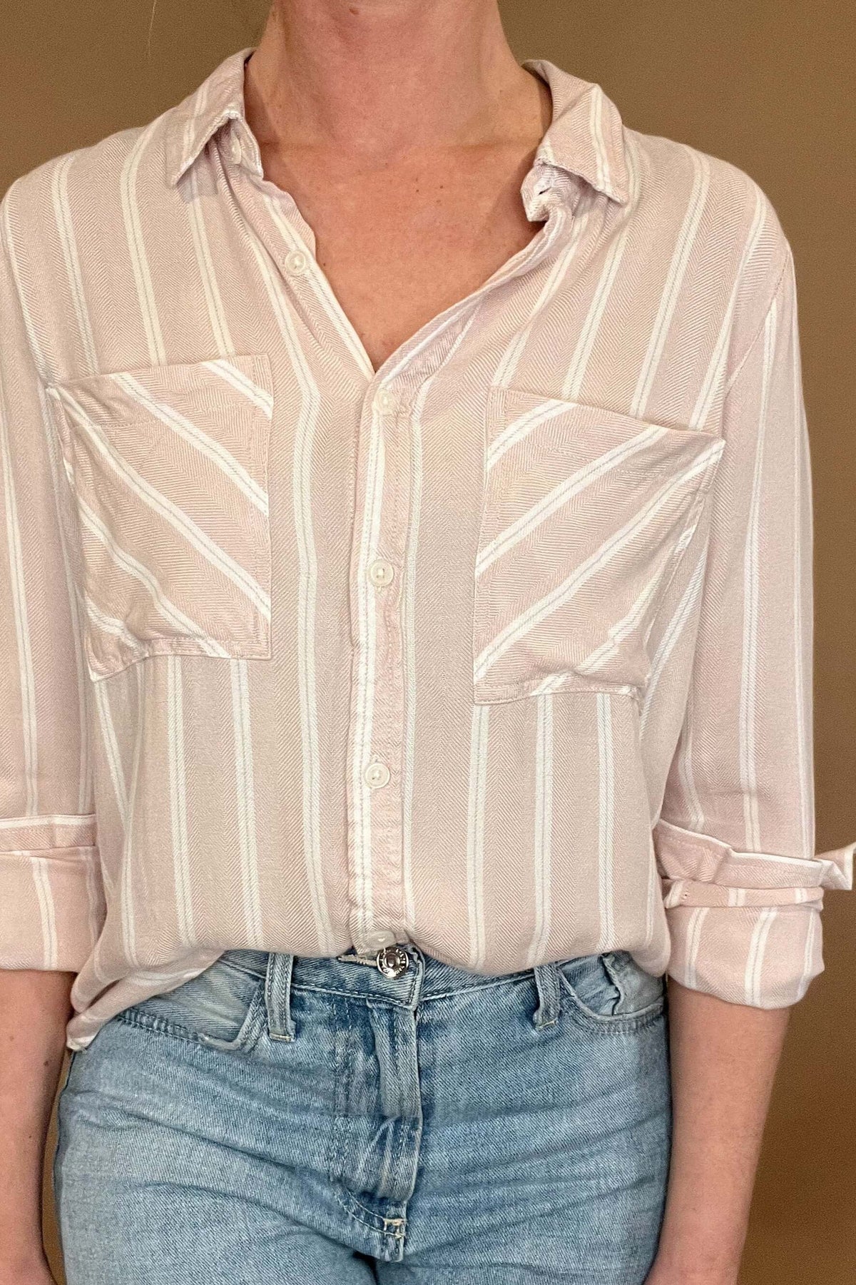 Introducing the Bestie Shirt in Blush, your new companion for the spring and summer season. Made with a luxurious lyocell blend, this stylish striped shirt is versatile enough to pair with any casual denim and sandals. Let it be your go-to piece for effortless fashion.