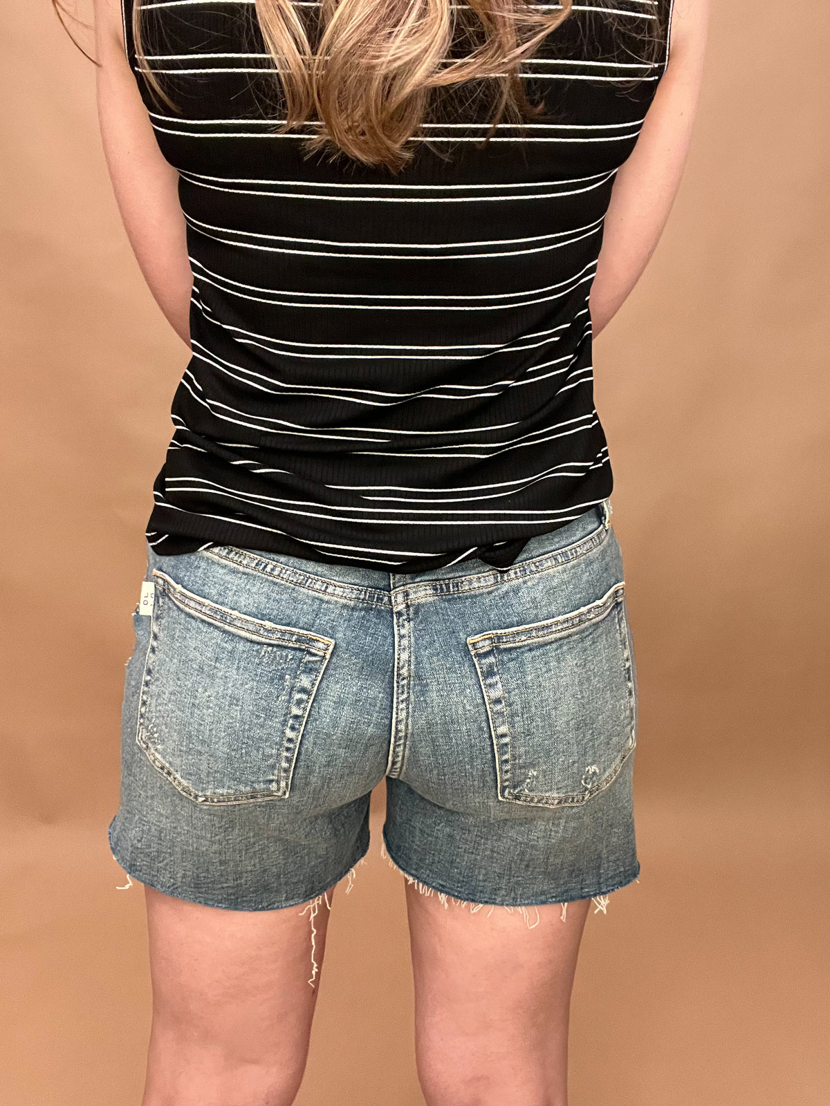 Our best selling Oliver Logan Denim Cut Above shorts are back in stock and ready for warm weather!&nbsp; The relaxed, comfy fit sits high on the waist and cuts off at the thigh. Made from yarn sourced from the Better Cotton Initiative (BCI), these denim shorts feature a buttoned fly and raw hem.&nbsp;