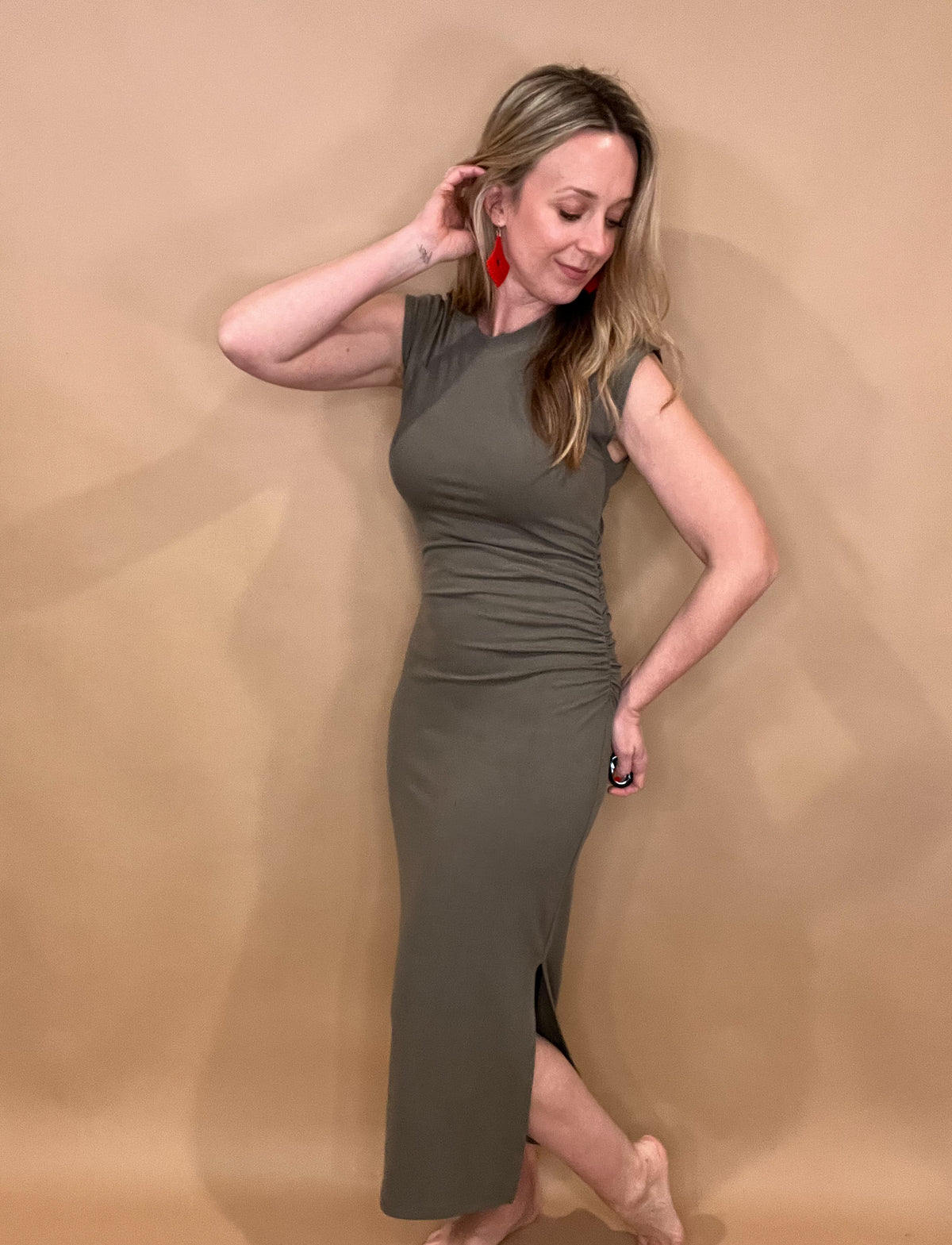 Step out in style with Olive You Dress! This perfect casual date night dress features a gathered waist, cap sleeves, and side slits on the maxi skirt. Pair it with a classic denim jacket and booties for a chic look now, and in the warmer months, switch it up with sandals and turquoise for a fresh and trendy look. Get ready to fall in love with this dress!