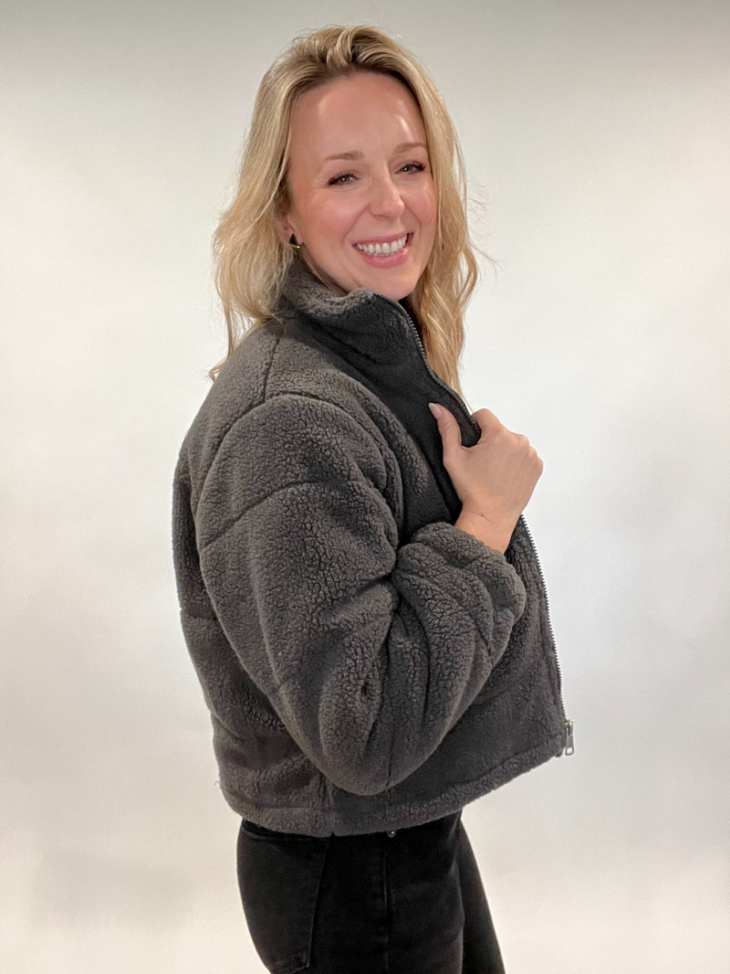 Stay warm and stylish with the Powder Puff Jacket. Its lined interior with slightly cropped cut makes it perfect for cool weather days. The pockets have secure zippers to keep your belongings safe, so you can wander with ease. A timeless piece for any wardrobe.