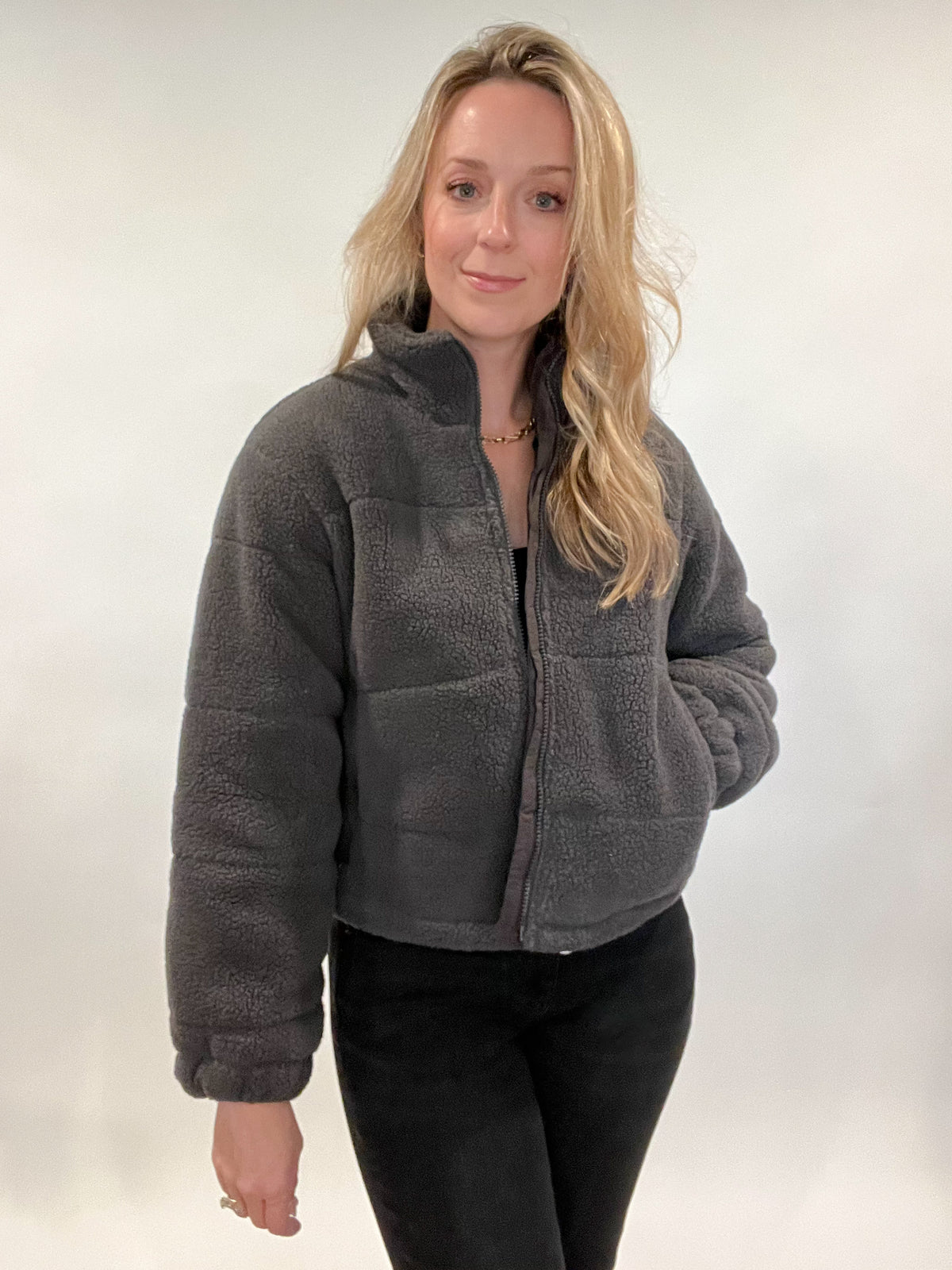 Stay warm and stylish with the Powder Puff Jacket. Its lined interior with slightly cropped cut makes it perfect for cool weather days. The pockets have secure zippers to keep your belongings safe, so you can wander with ease. A timeless piece for any wardrobe.