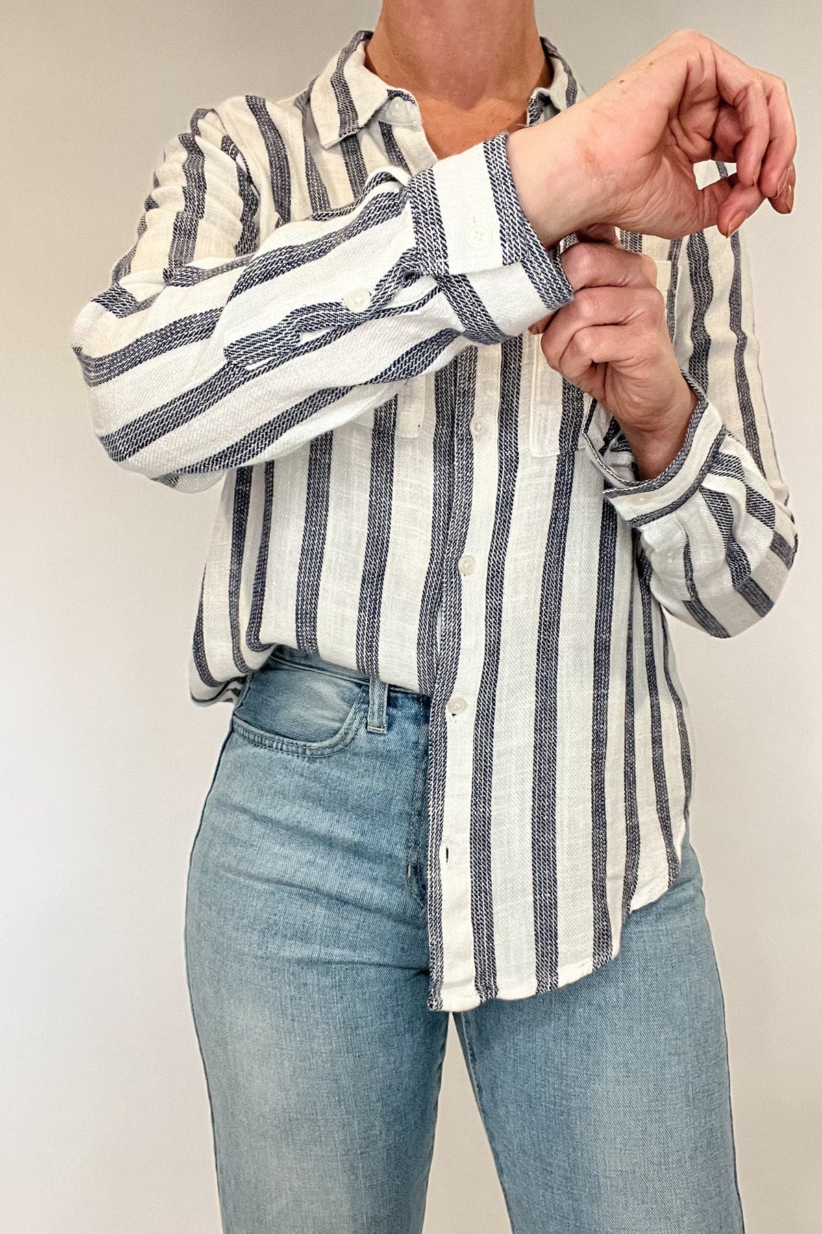 Introducing the Bestie Shirt in Blue, your new companion for the spring and summer season. Made with a luxurious linen blend, this stylish striped shirt is versatile enough to pair with any casual denim and sandals. Let it be your go-to piece for effortless fashion.