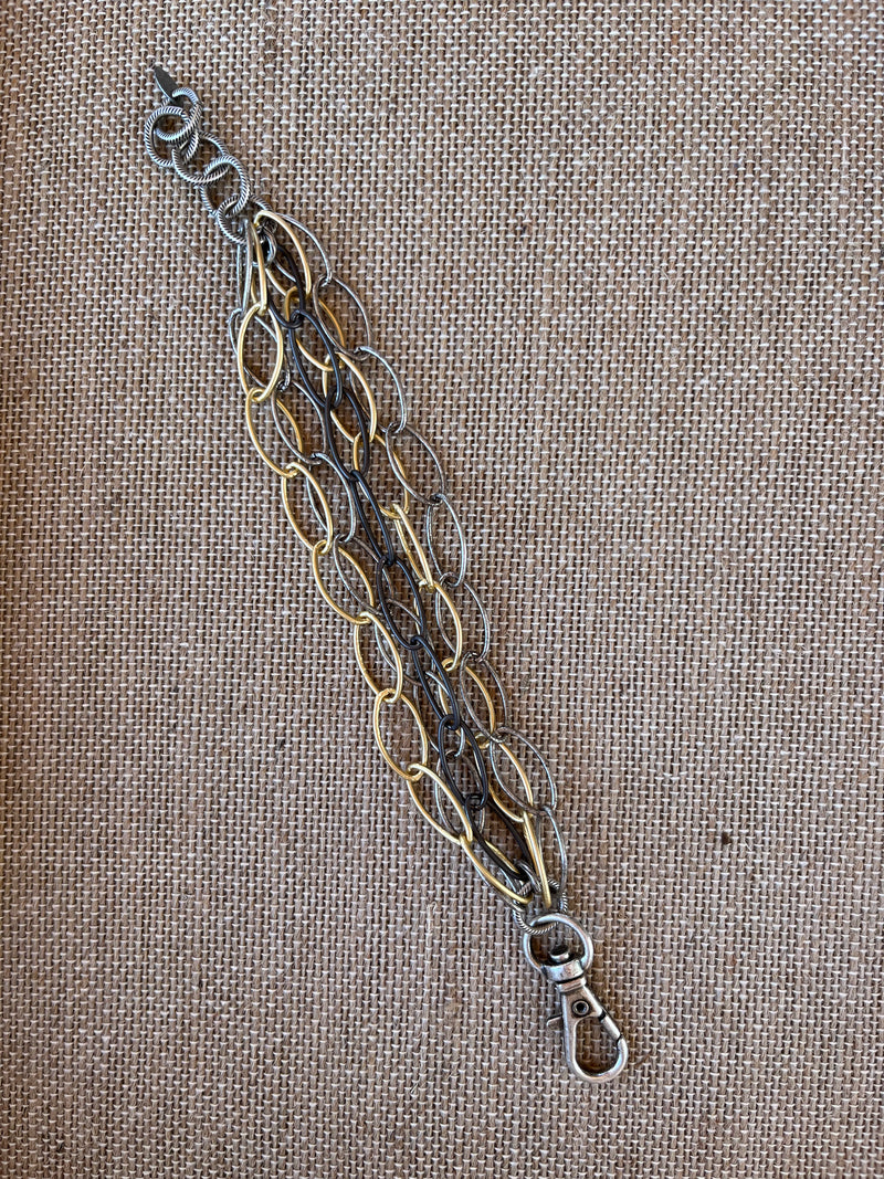 <p>This exquisite adjustable Multi Strand Matte Chain Bracelet crafted with luxurious Gold, Pewter, and Gunmetal links, ensures a truly sophisticated look. Boasting an adjustable length from 6 3/4 to 8 inches, this exquisite bracelet will add a touch of class and elegance to any outfit.</p> <p data-mce-fragment="1">Made in the USA</p>