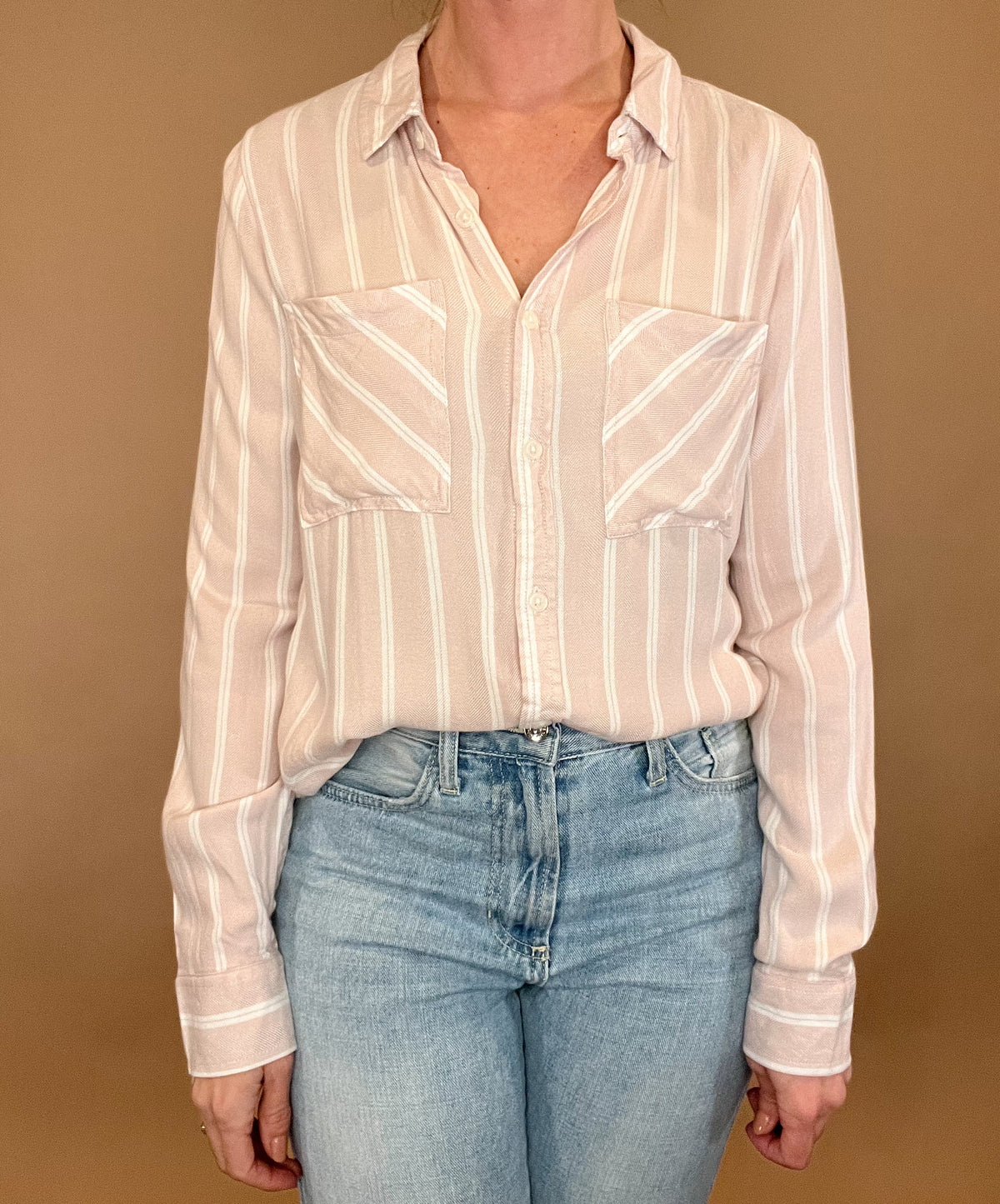 Introducing the Bestie Shirt in Blush, your new companion for the spring and summer season. Made with a luxurious lyocell blend, this stylish striped shirt is versatile enough to pair with any casual denim and sandals. Let it be your go-to piece for effortless fashion.