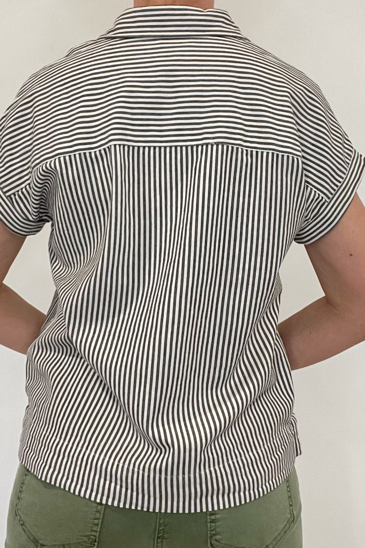 The Revel top is effortlessly beautiful with&nbsp; stripes, a split hem &amp;&nbsp;a tacked rolled sleeve.&nbsp;Made from 100% cotton, this stylish striped shirt is versatile enough to pair with any casual denim and sandals. Let it be your go-to piece for effortless fashion.