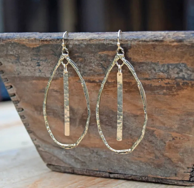 Indulge in the exquisite artistry of these teardrop hoops, handcrafted with hammered Gold Bronze and Sterling Silver accents on Gold filled ear wires. Measuring a regal 2 3/4-inches, these earrings emanate elegance and are proudly made in the USA.