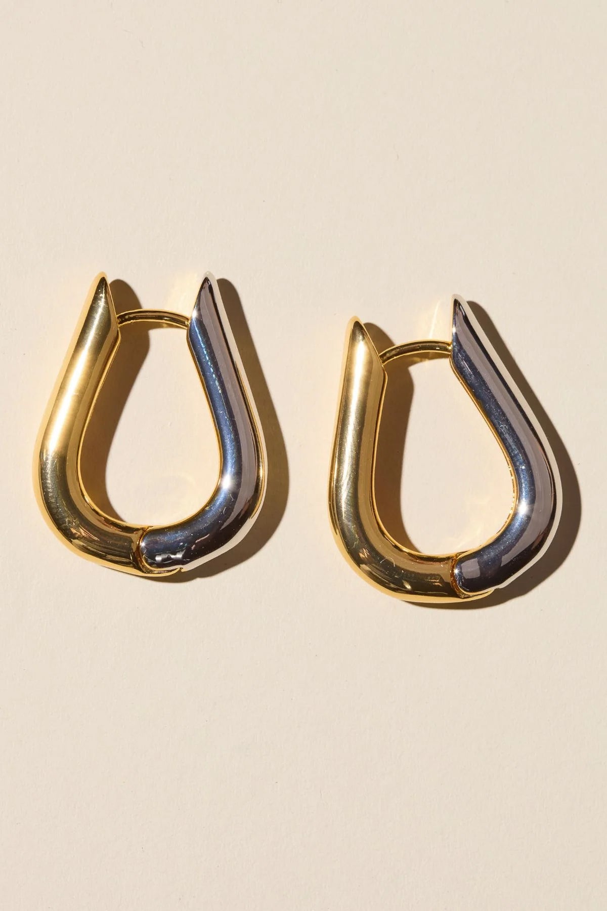 two tone huggie earrings, mixed metal earrings, waterproof earrings, PVD plated jewelry, nickel free earrings, hypoallergenic earrings, huggie hoop earrings, small hoop earrings, everyday earrings, modern earrings, women’s fashion jewelry, boutique earrings, effortless style jewelry, gold silver earrings, trendy women’s accessories, Cotton & Cashmere boutique, Blanco Texas boutique, women’s jewelry online