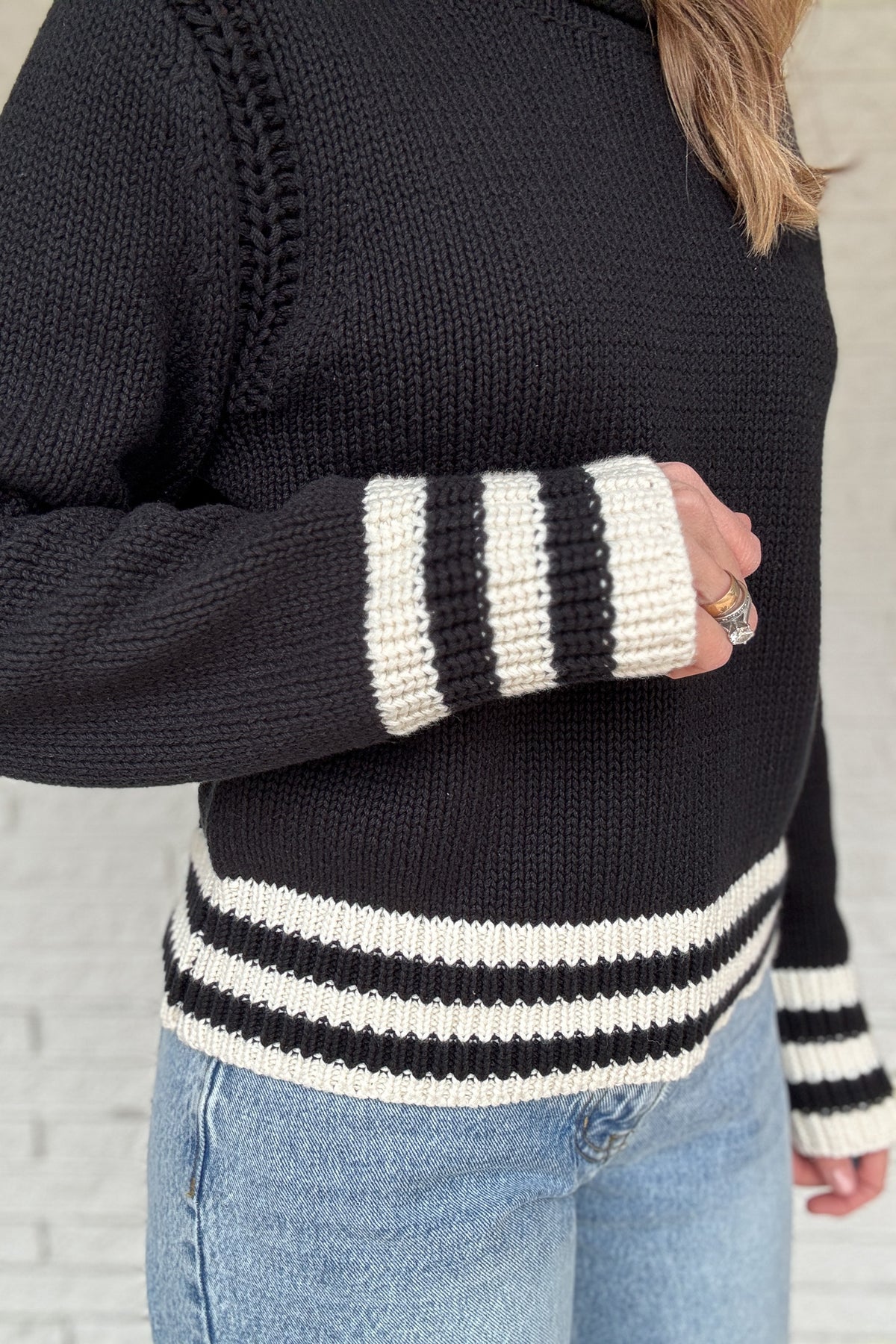 This classic striped knit is the kind of sweater you’ll wear all season long. Made from a heavy 100% cotton knit, it has a cozy, substantial feel without being bulky. The contrast stripes at the hem and cuffs add a clean, sporty touch that keeps it timeless and easy.