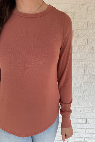 Soft, simple, and effortlessly flattering — this long sleeve top is your new everyday go-to. Made from luxe micro modal with a hint of stretch, it drapes beautifully and feels silky smooth against the skin. Perfect for layering or wearing solo with your favorite denim.
