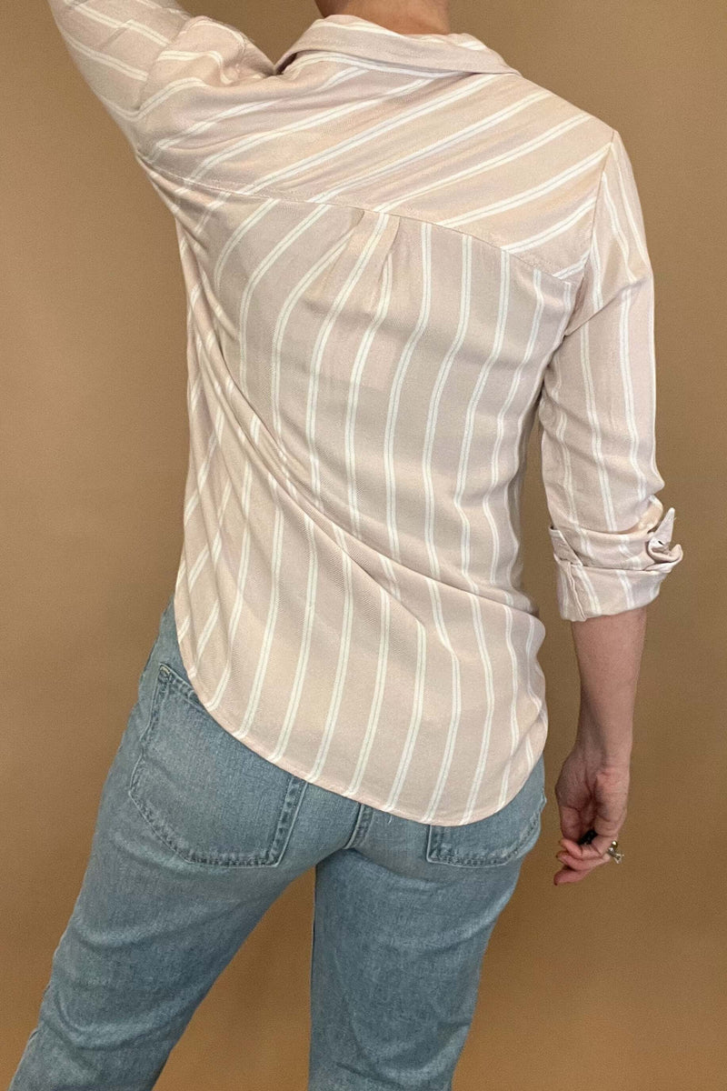 Introducing the Bestie Shirt in Blush, your new companion for the spring and summer season. Made with a luxurious lyocell blend, this stylish striped shirt is versatile enough to pair with any casual denim and sandals. Let it be your go-to piece for effortless fashion.