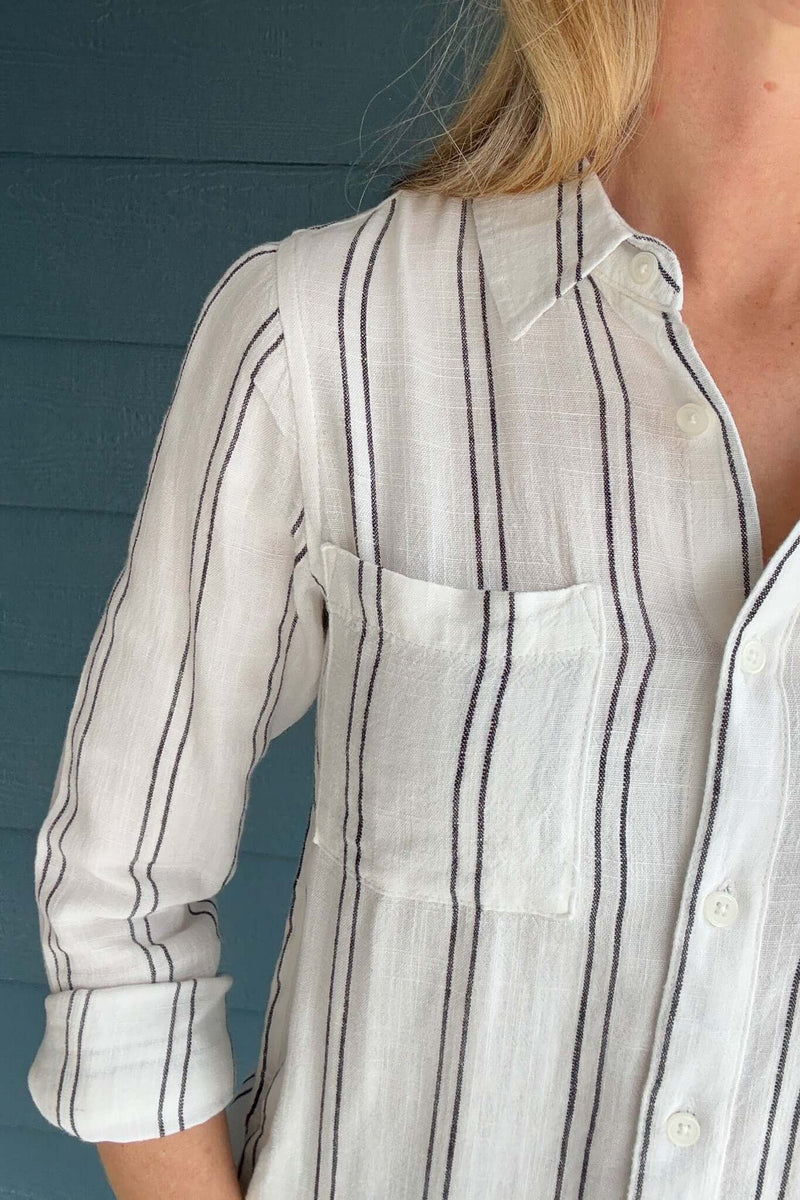 Introducing the Bestie Shirt in Black, your new companion for the spring and summer season. Made with a luxurious linen blend, this stylish striped shirt is versatile enough to pair with any casual denim and sandals. Let it be your go-to piece for effortless fashion.