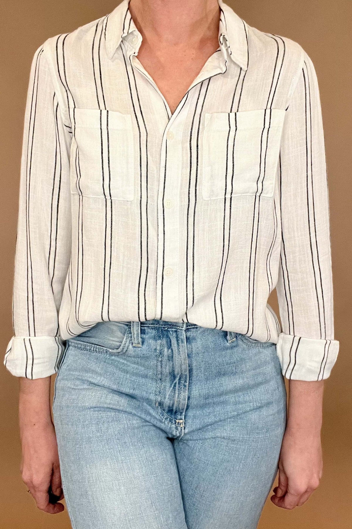 Introducing the Bestie Shirt in Black, your new companion for the spring and summer season. Made with a luxurious linen blend, this stylish striped shirt is versatile enough to pair with any casual denim and sandals. Let it be your go-to piece for effortless fashion.