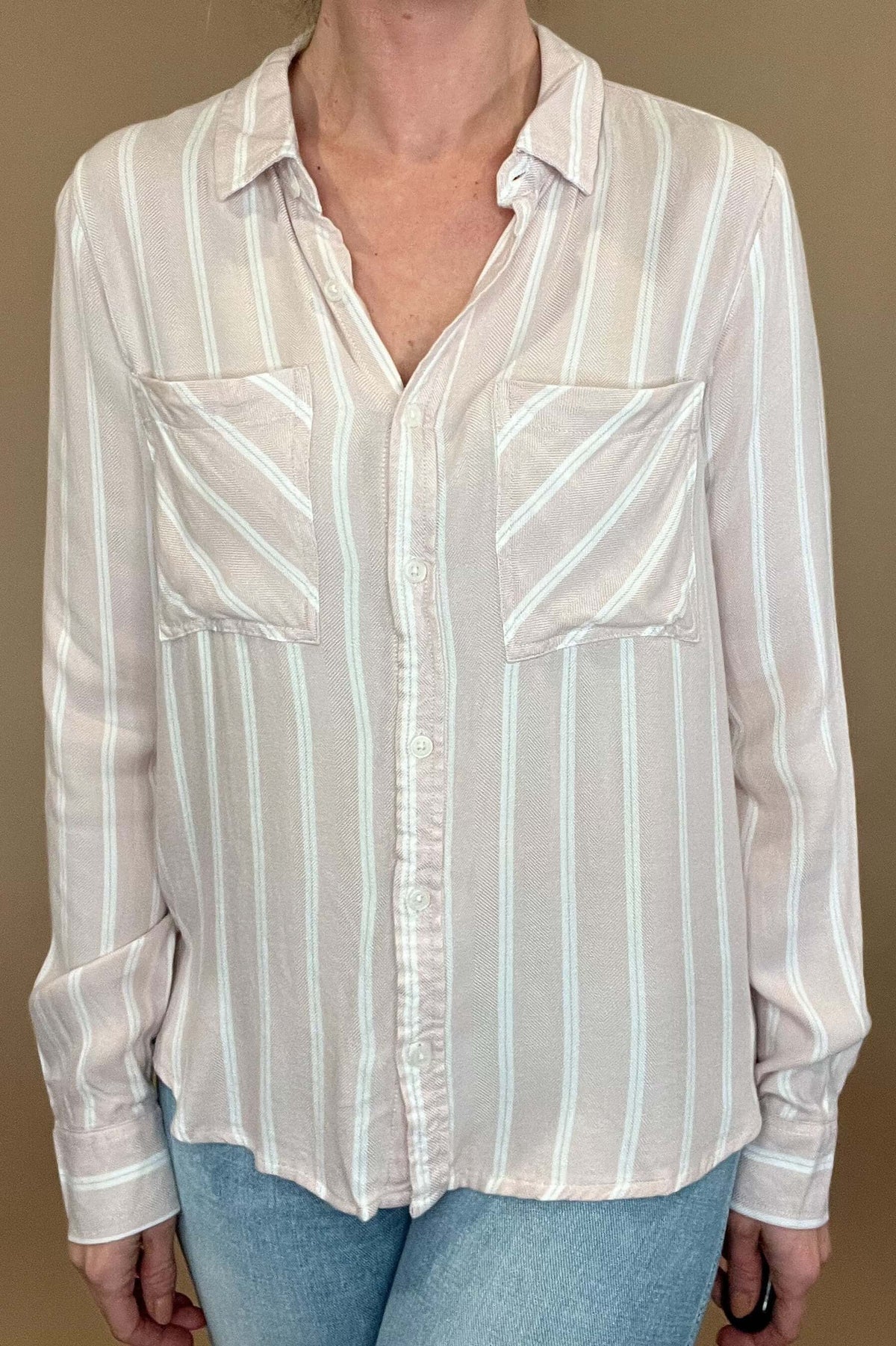 Introducing the Bestie Shirt in Blush, your new companion for the spring and summer season. Made with a luxurious lyocell blend, this stylish striped shirt is versatile enough to pair with any casual denim and sandals. Let it be your go-to piece for effortless fashion.